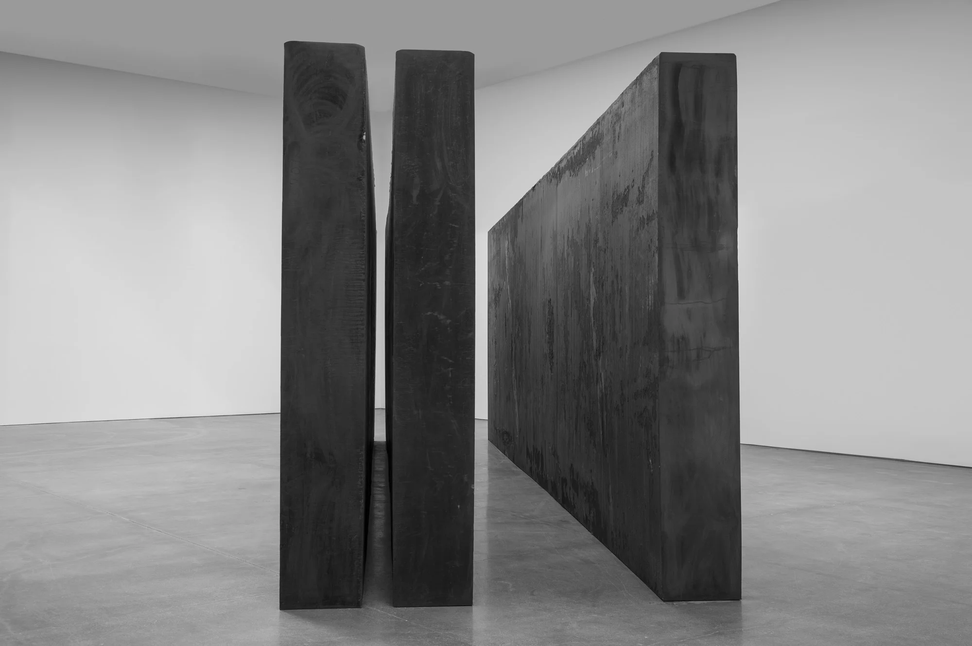 RICHARD SERRA Through, 2015 Forged steel Three slabs, each: 9’ 2“ x 29’ 6” x 16” (2.8 m x 9 m x 40.6 cm) Overall: 9’ 2” x 29’ 6” x 92“ (2.8 m x 9 m x 234.3 cm) © Richard Serra. Photograph by Cristiano Mascaro.