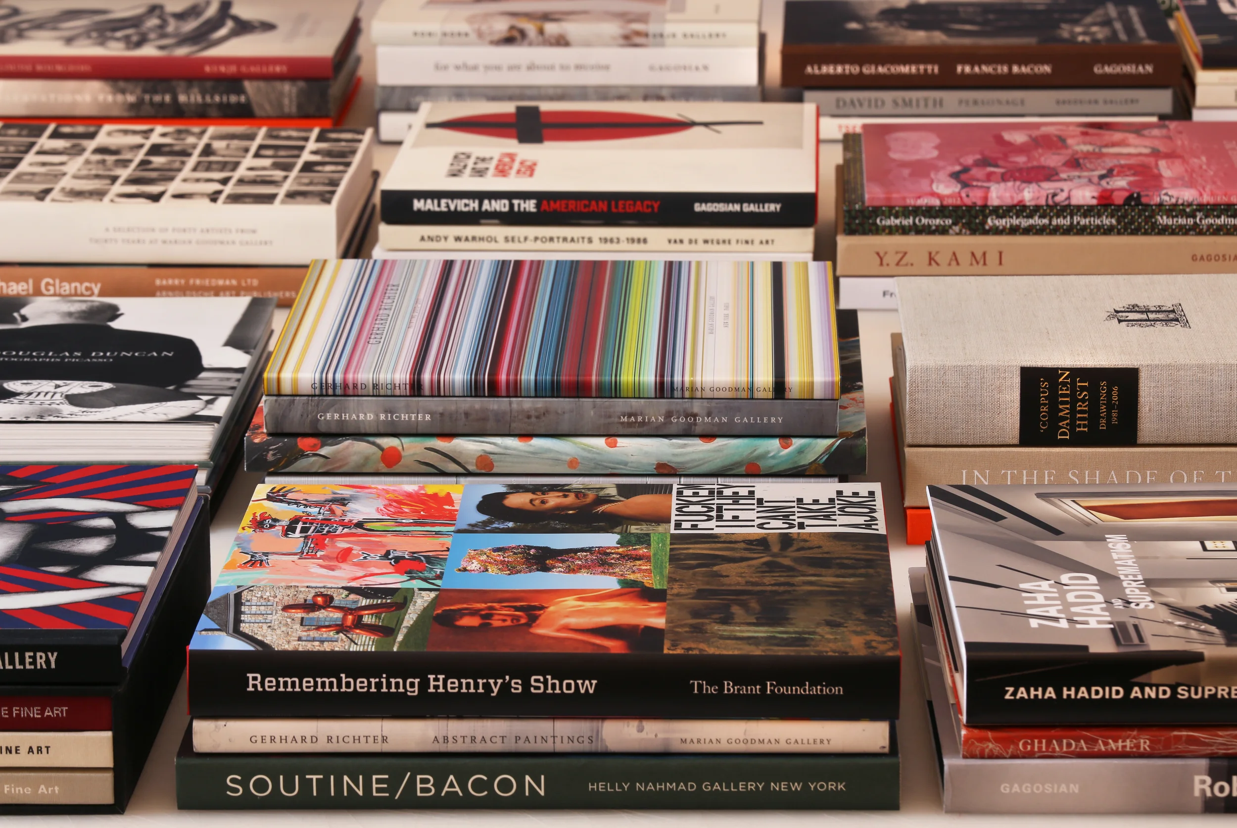 Collection of art publications designed by Dan Miller Design