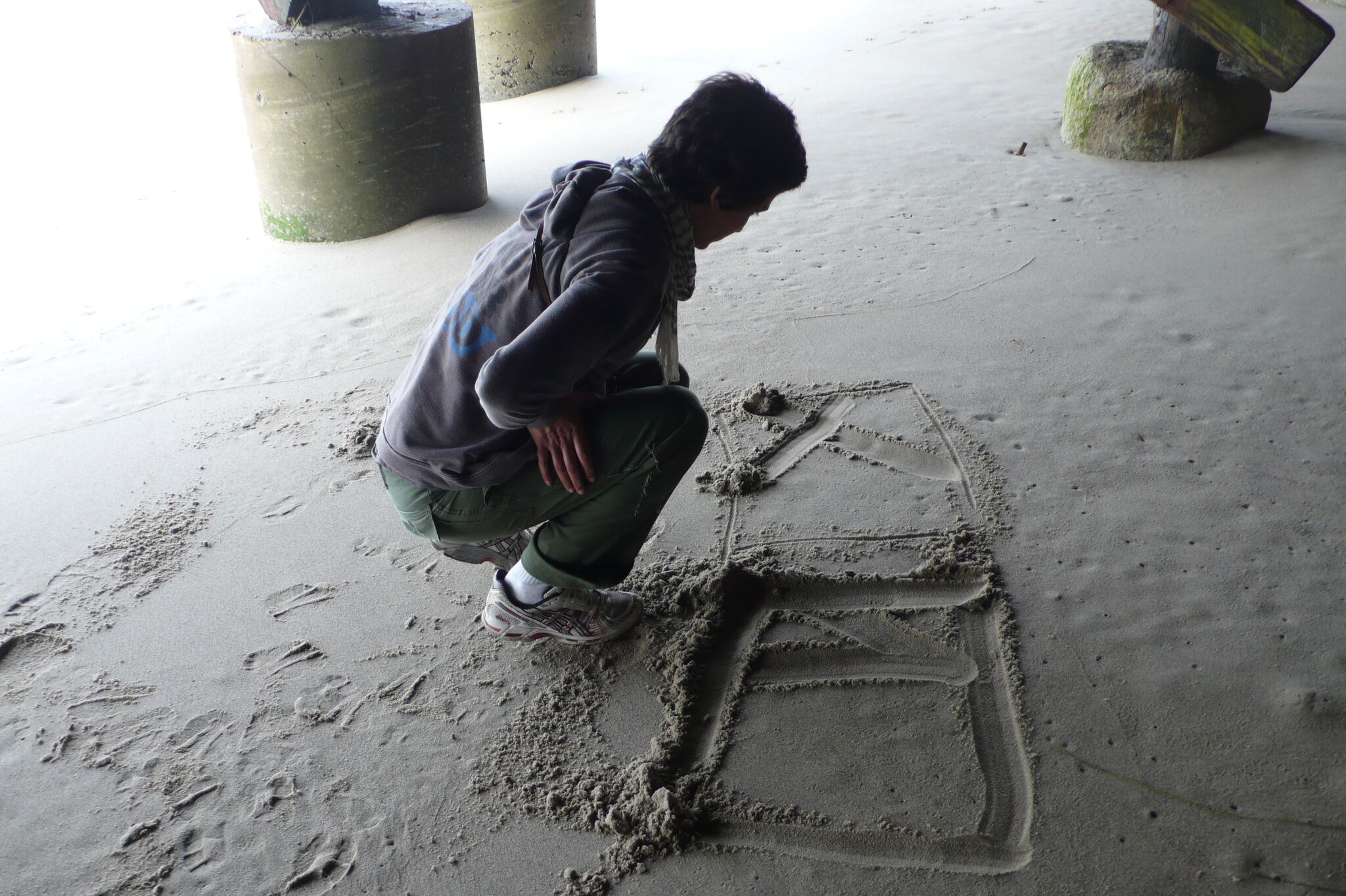AH drawing in sand under house #2