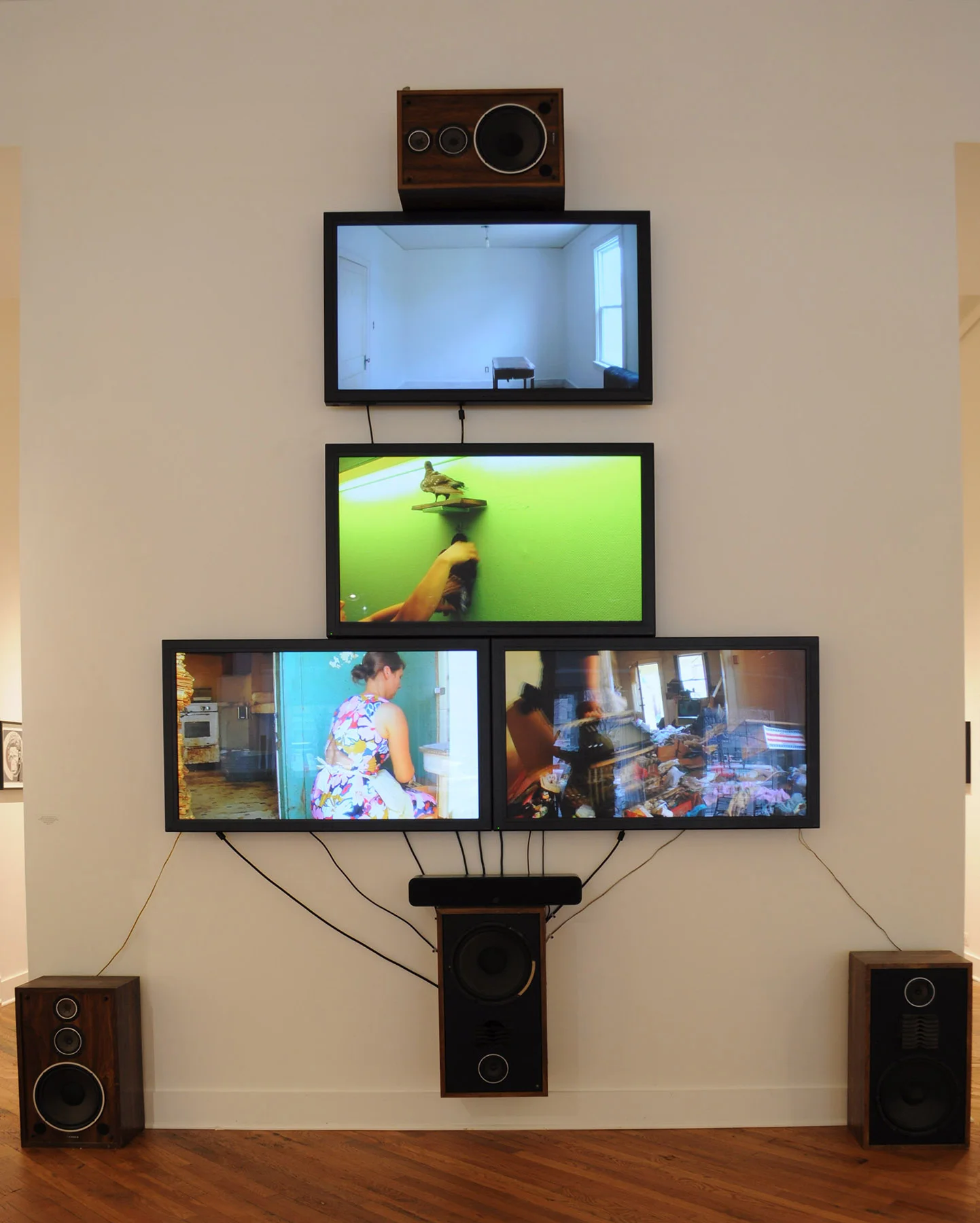 Ushers of the Accumulated 2017 , HD video with sound, plasma monitors, speakers, wires, cables, media players. 154 x 124 x 12 inches Unique