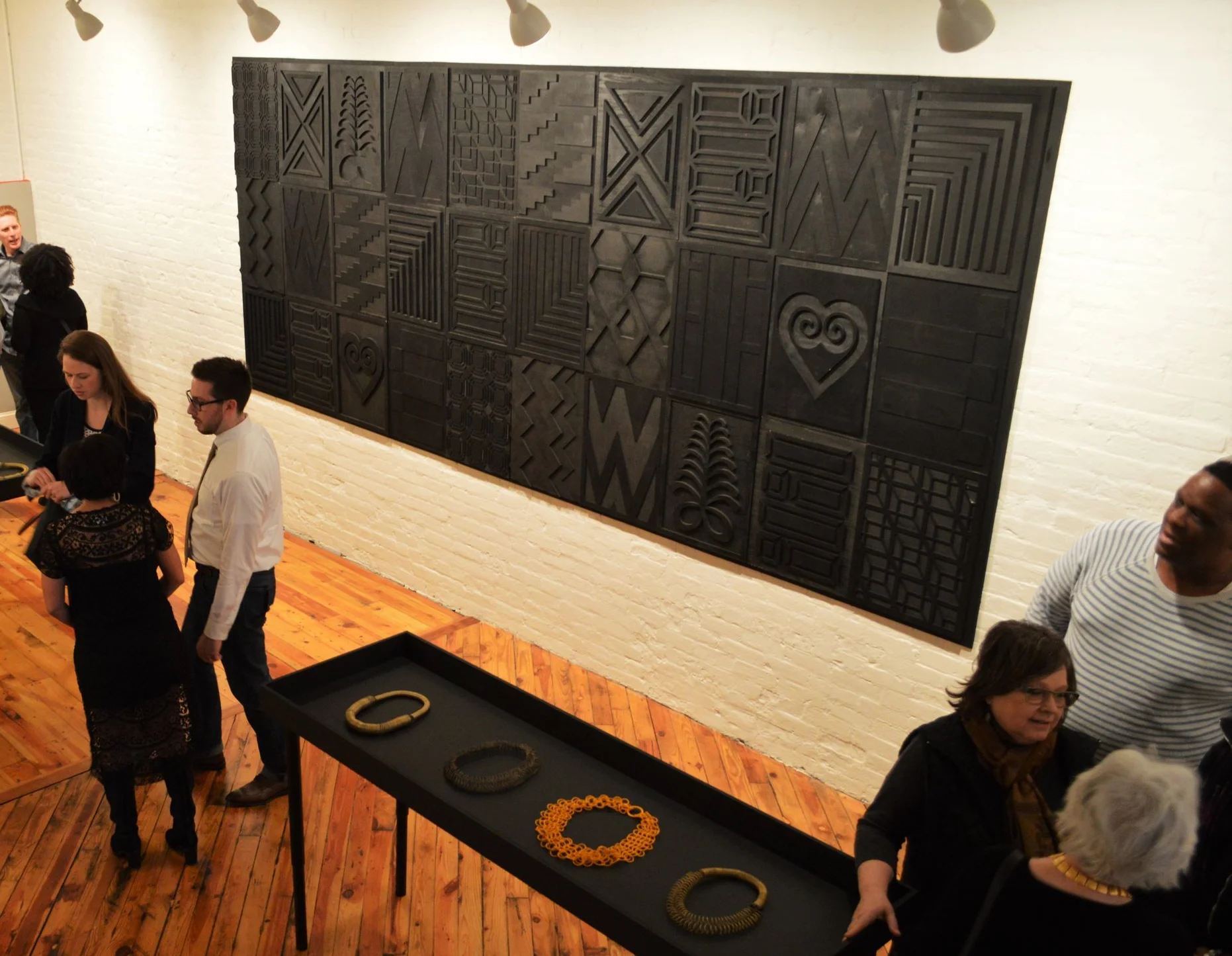 Tiff Massey, Installation view: Noir Quilt Code 2 , 180” x 72” (variable), wood, 2015. Image Courtesy of the artist.