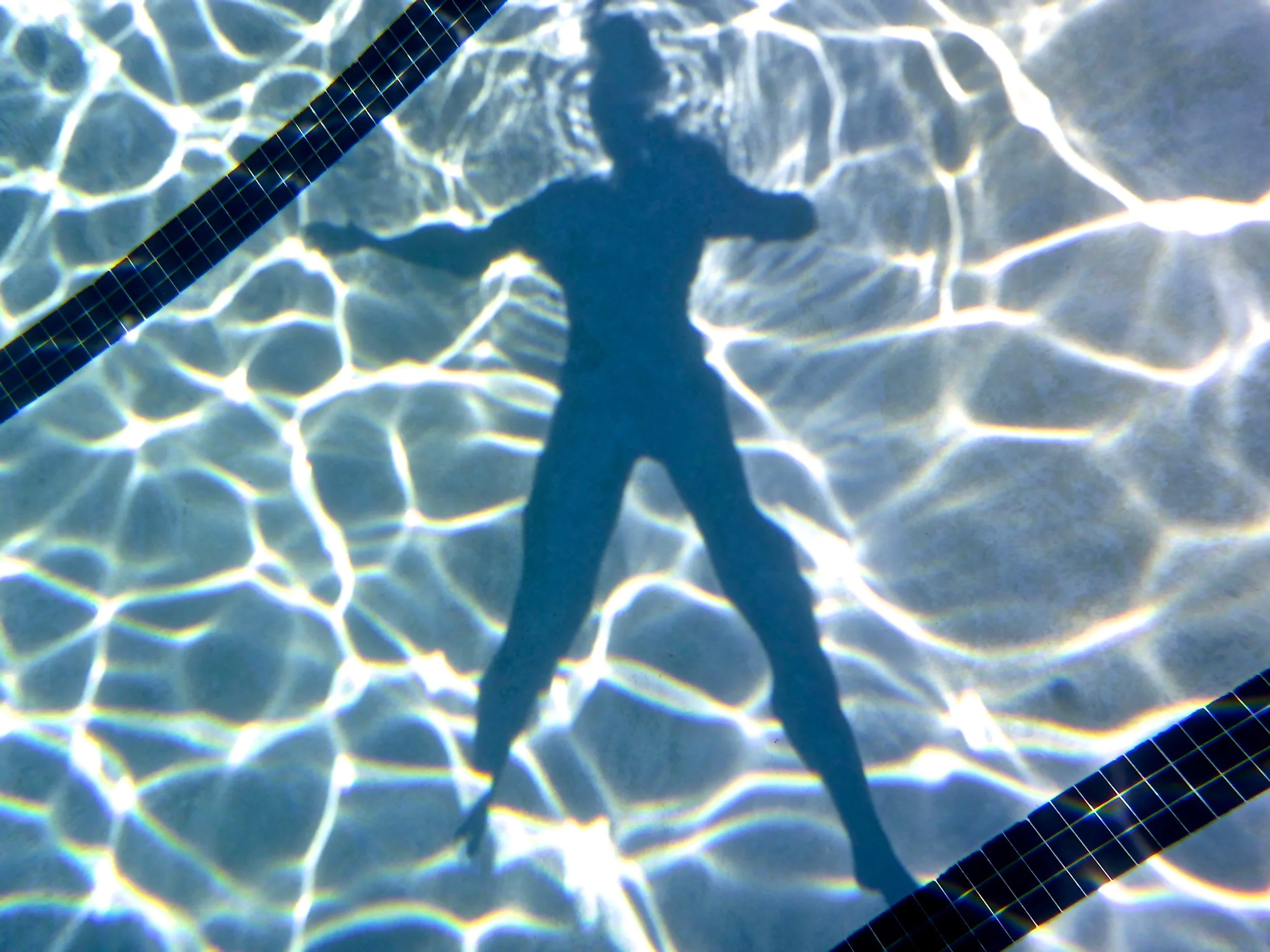 'EXPANDING SWIMMER SHADOW' - Every single second, a swimmers shadow changes, just as the water itself. 