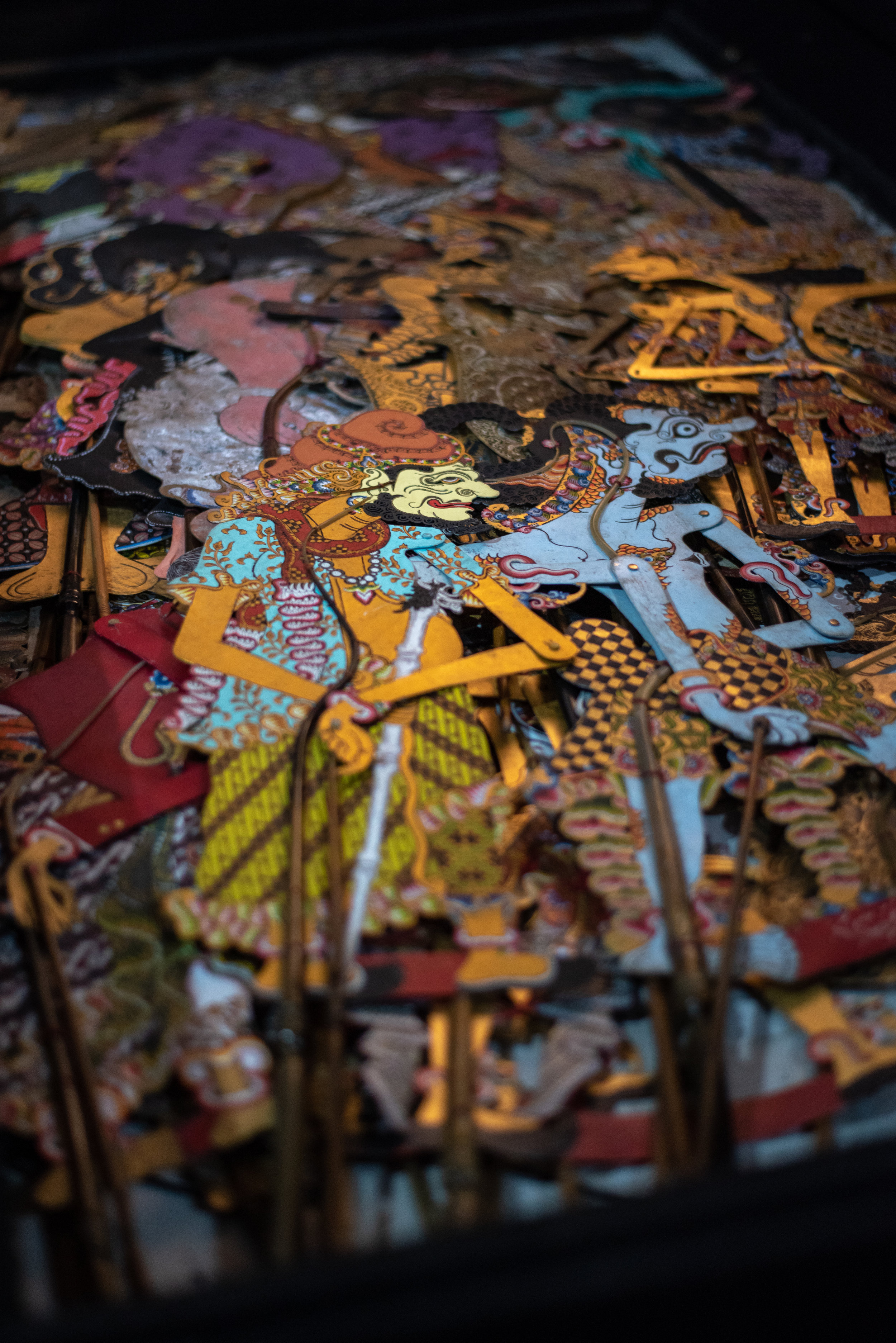 Shadow puppets stacked in the cempala (large wooden chest)