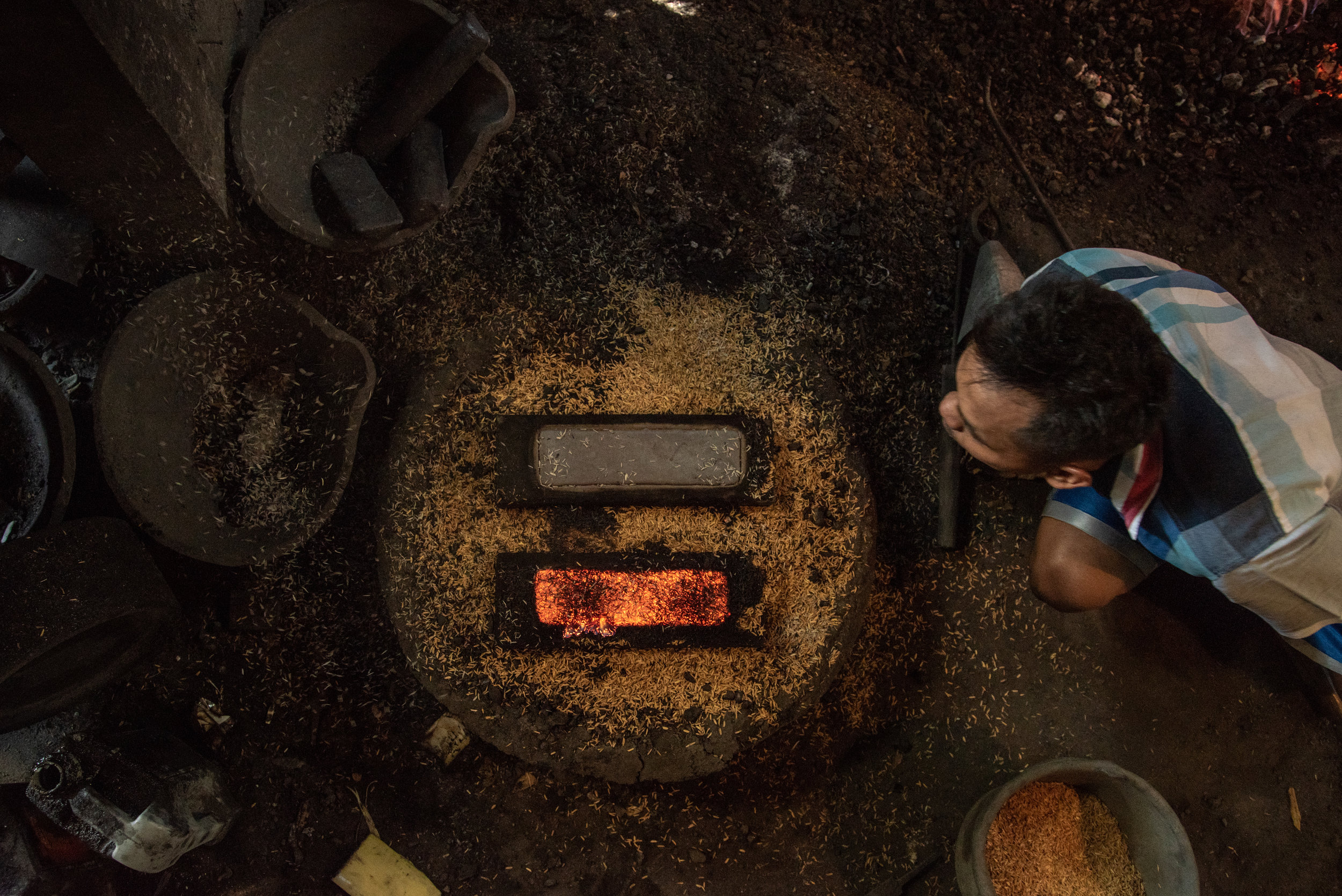  Gamelan maker blows on molten keys 