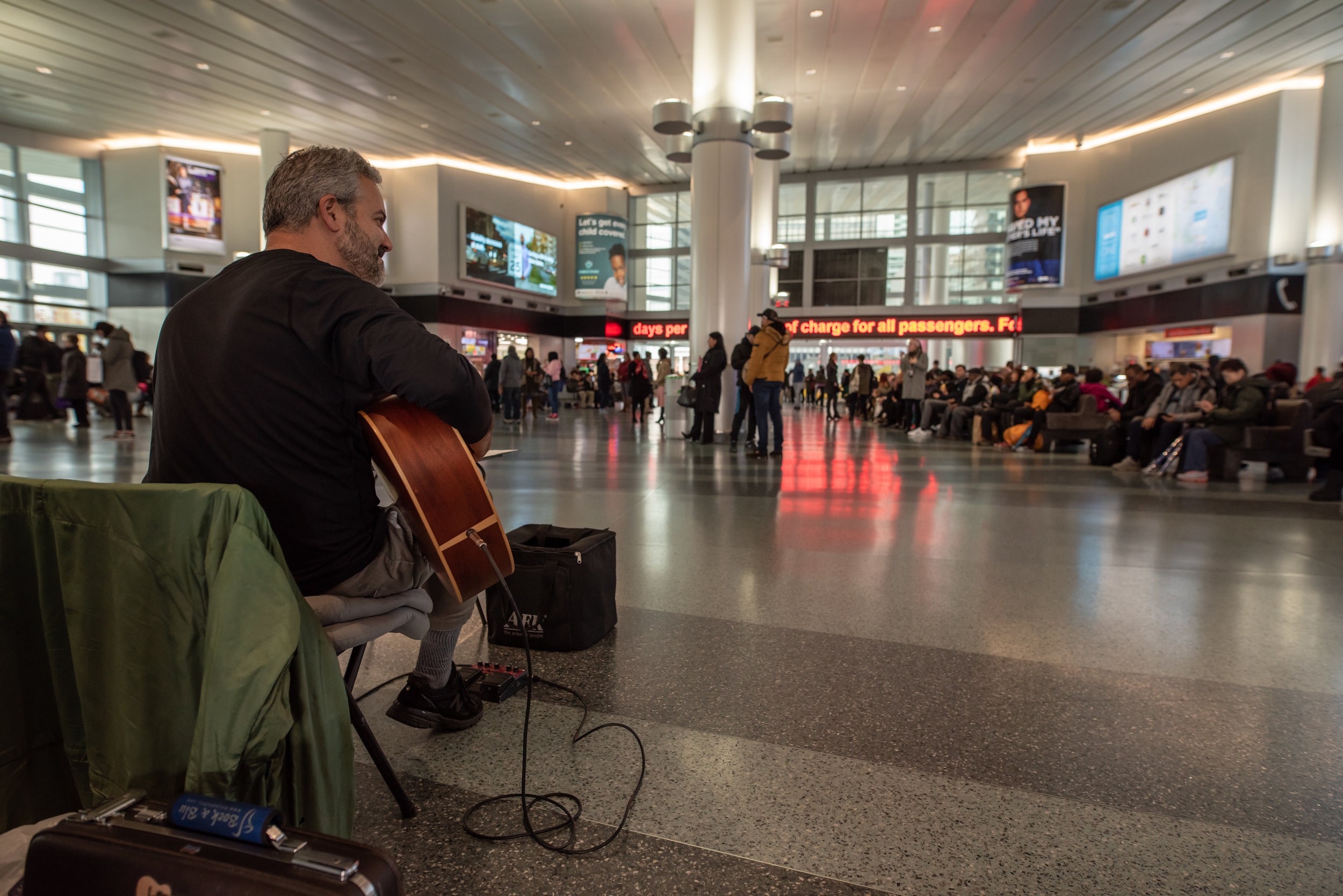 Glenn performs at Whitehall terminal for the Staten Island Ferry.
