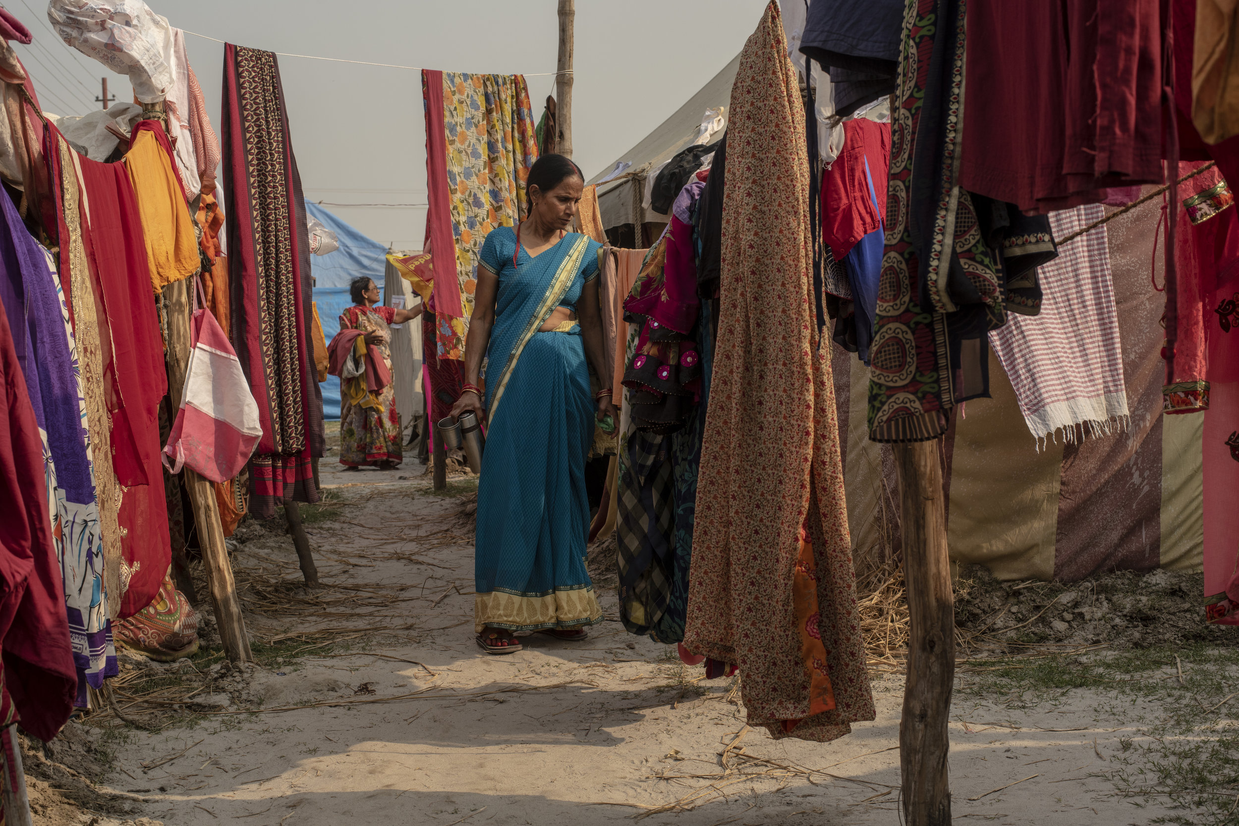  Women hang sarees out to dry 