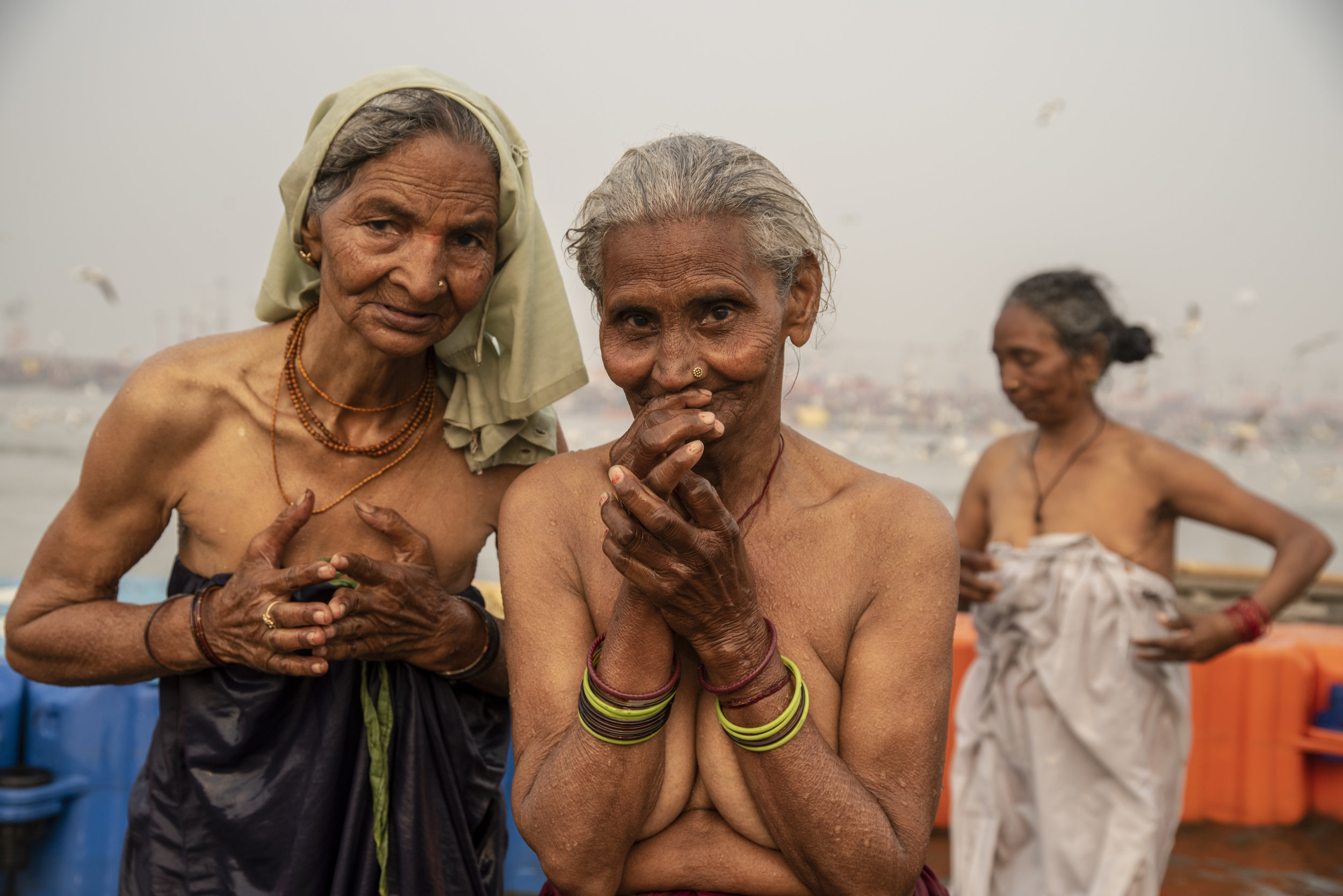  Elder women bathe in the Ganges 