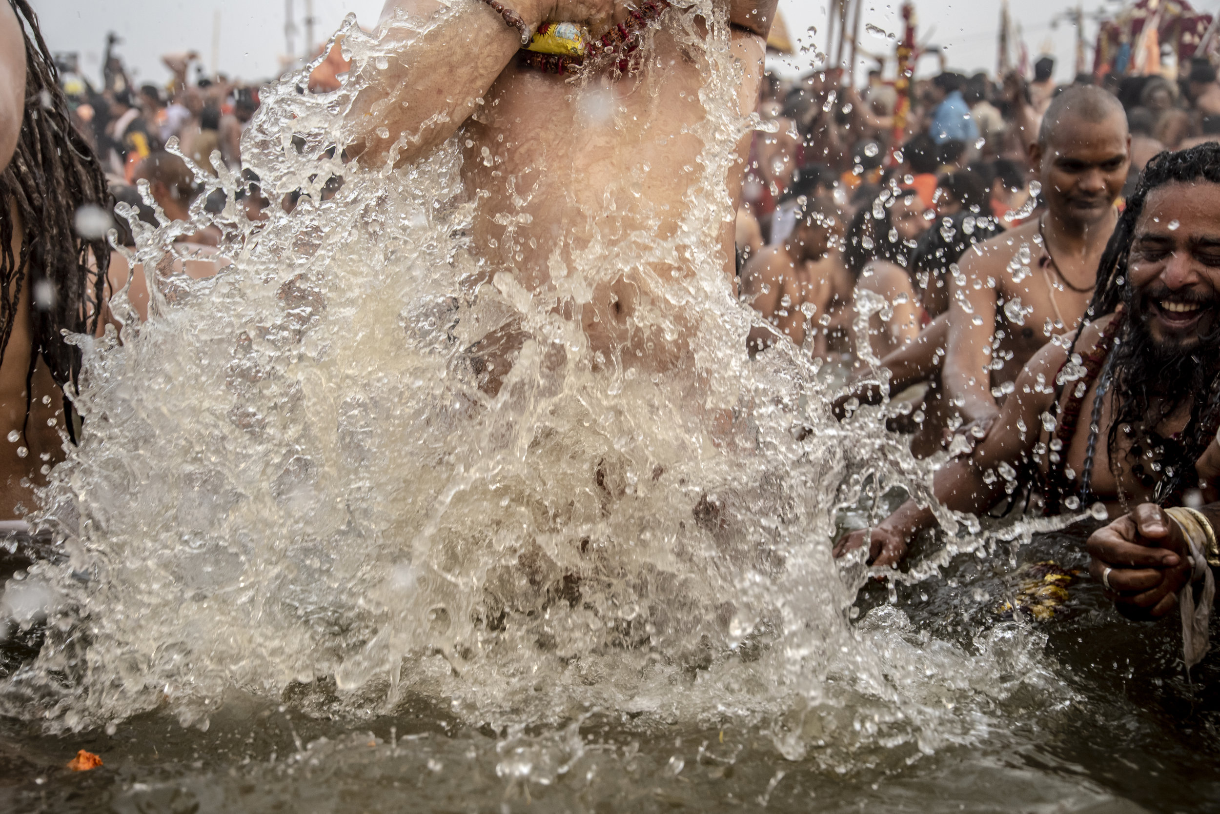 Naga Sadhus rush into the Sangam during the celebration of Shahi Snan