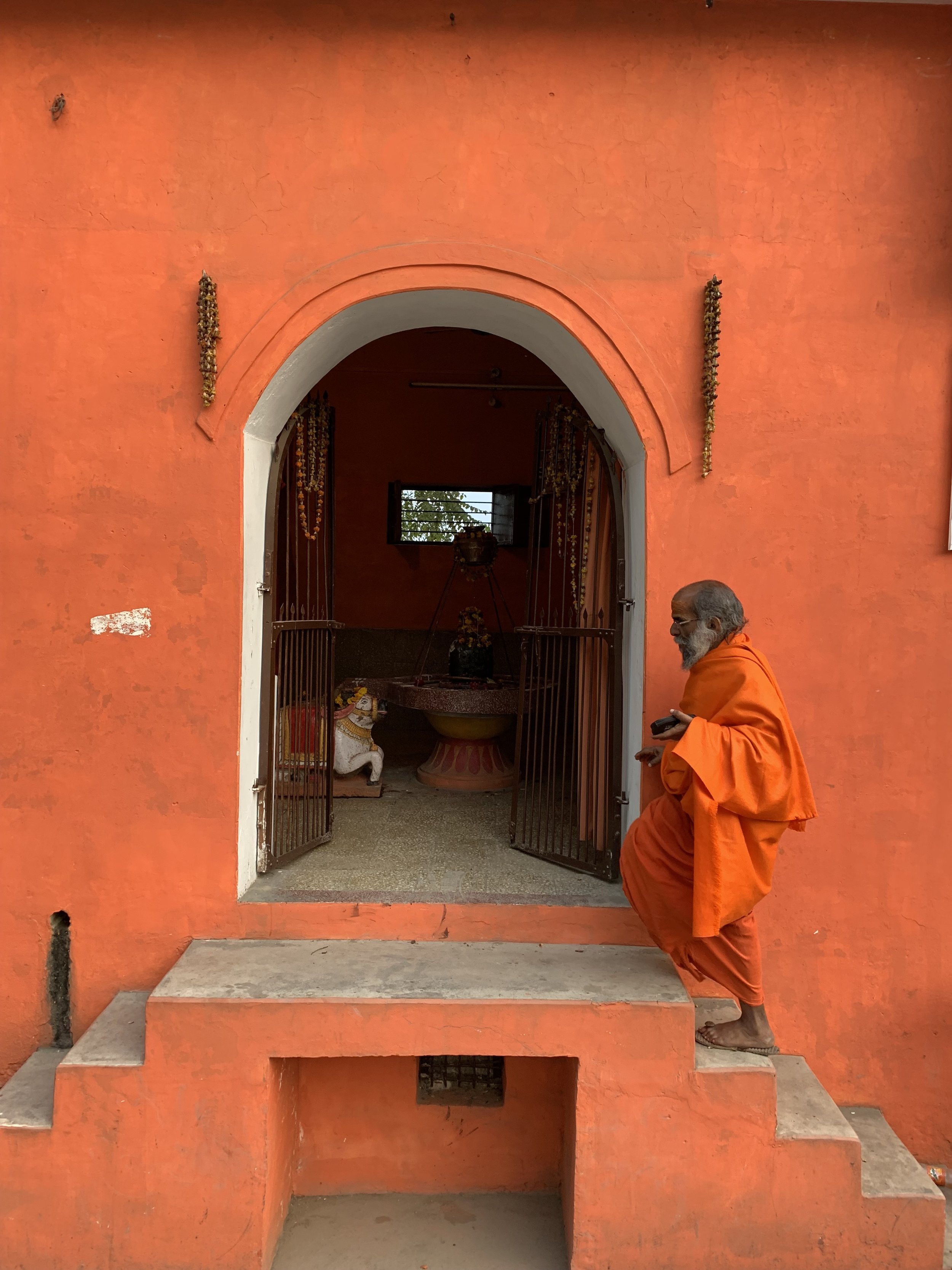  Guru enters a Hindu temple that he upkeeps. 