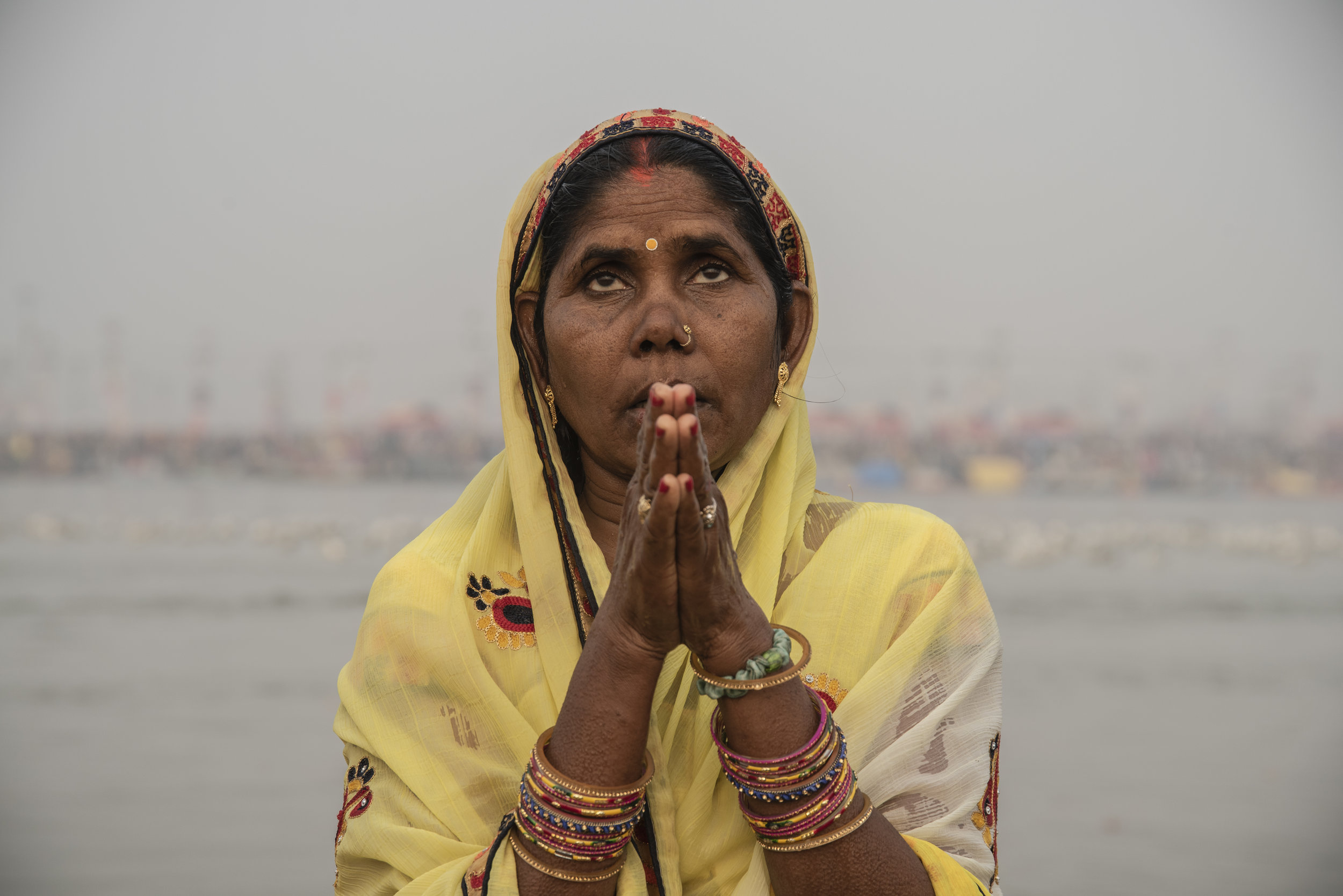 Woman prays to Mother Ganga