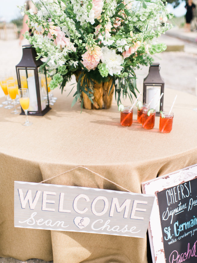 Welcome table with lush centerpiece