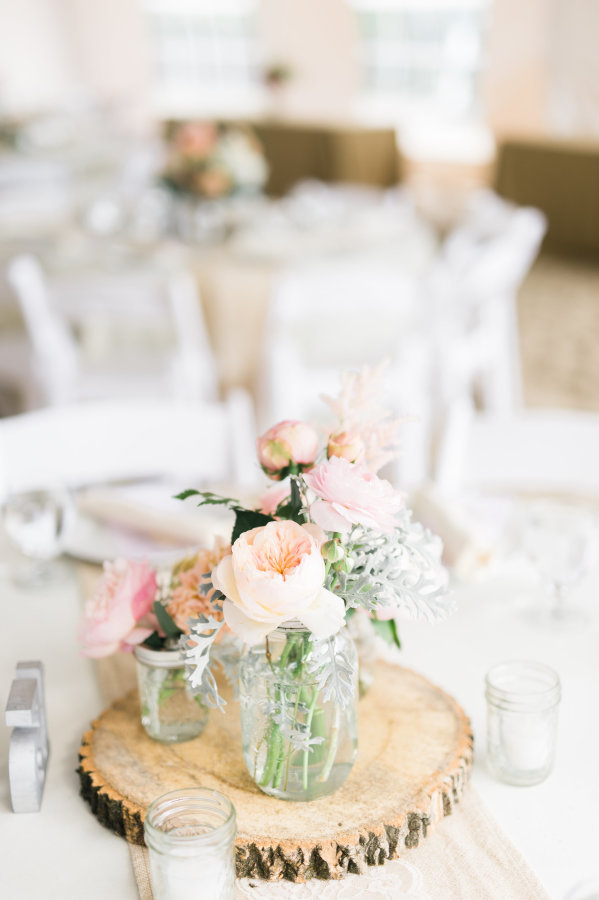 Mason jar centerpiece with wood slice