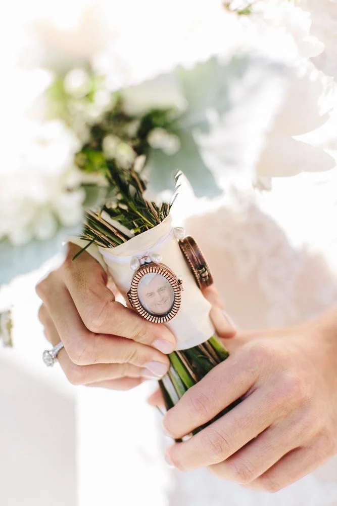 brass charms adorn bridal bouquet
