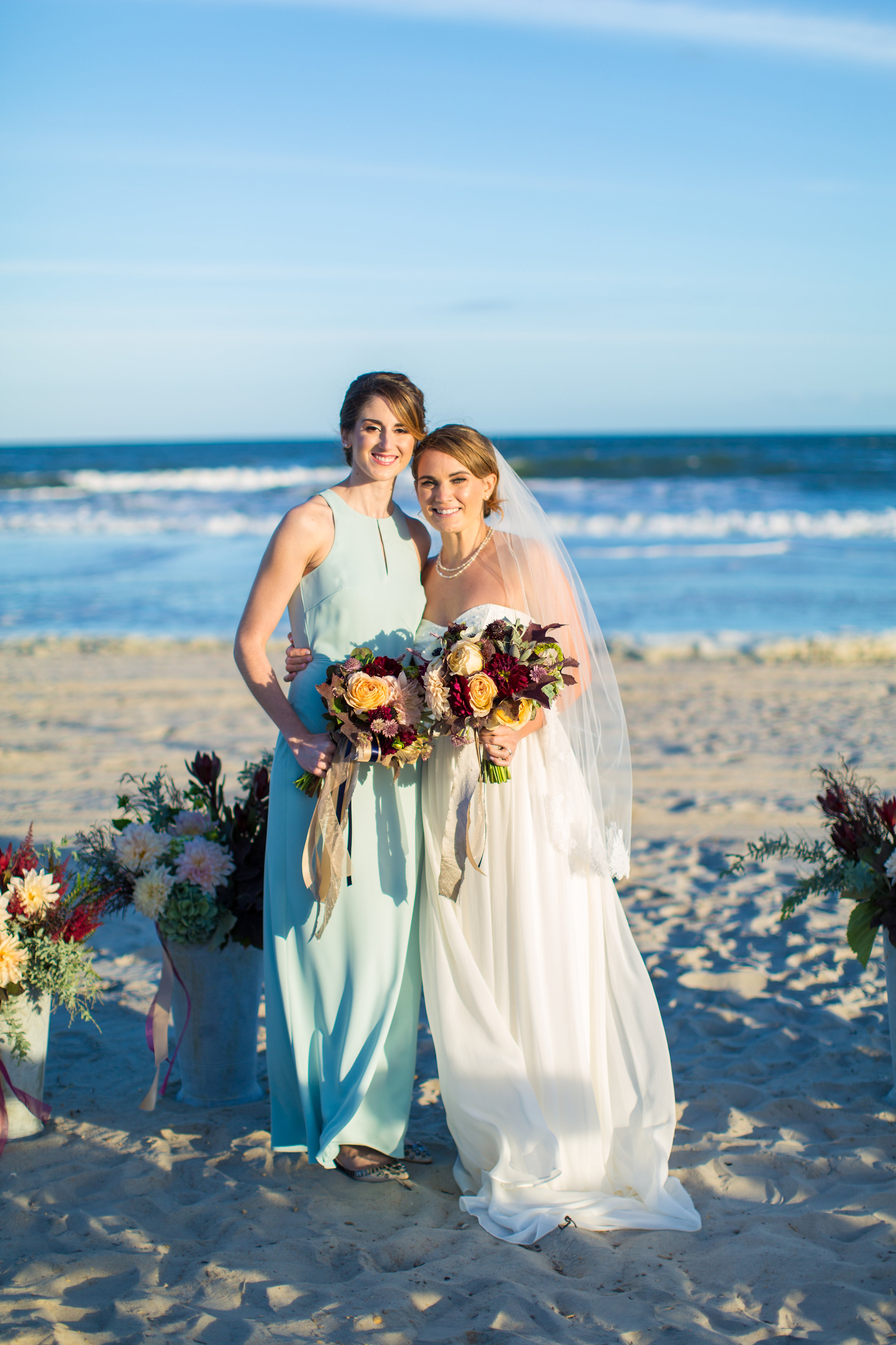 Jenna's bridesmaid carried a similar bouquet to her own, which contrasted perfectly with the light teal shade of her dress. 