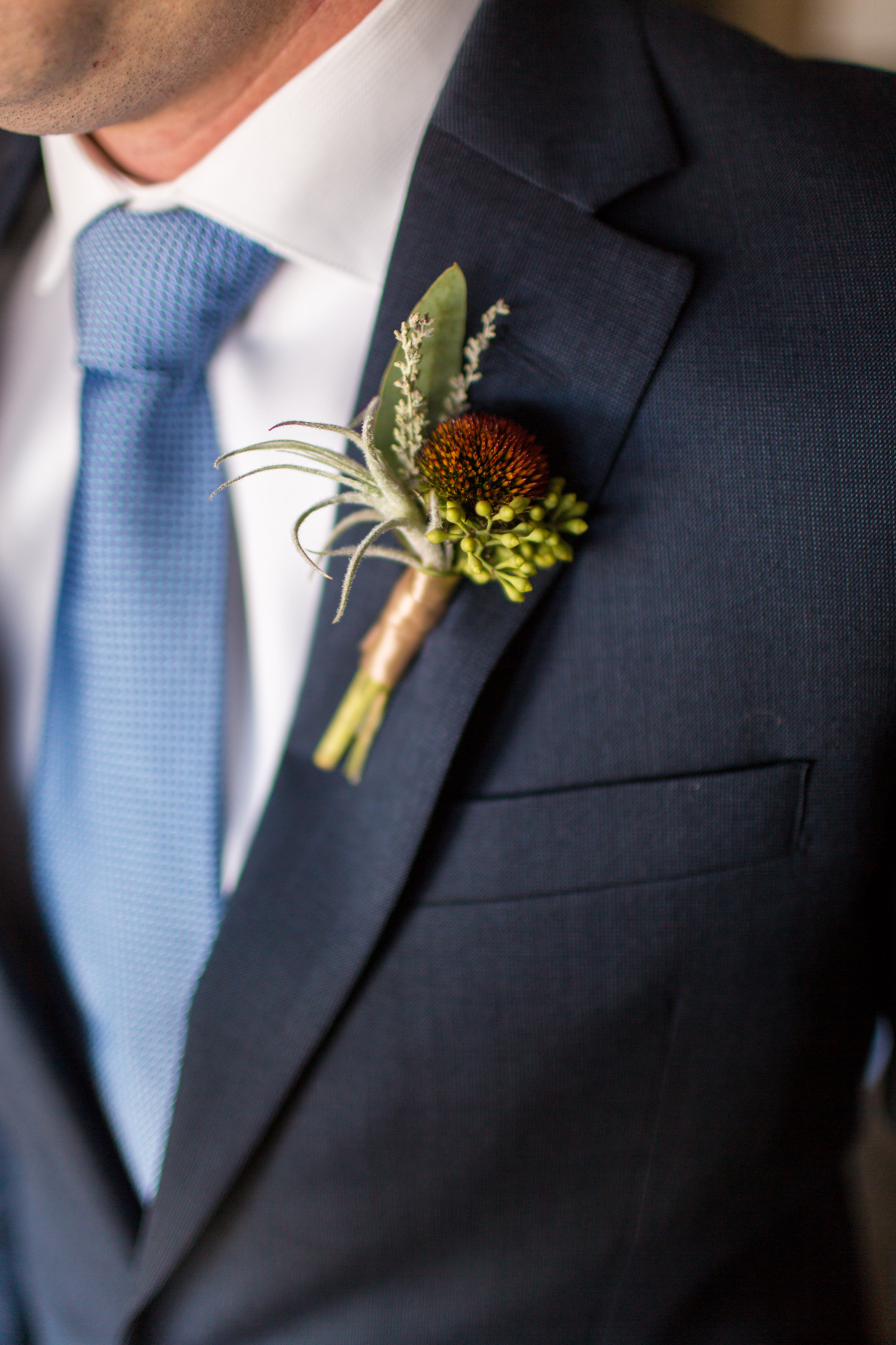 We tucked some airplant into Jon's bout for a textural look. 