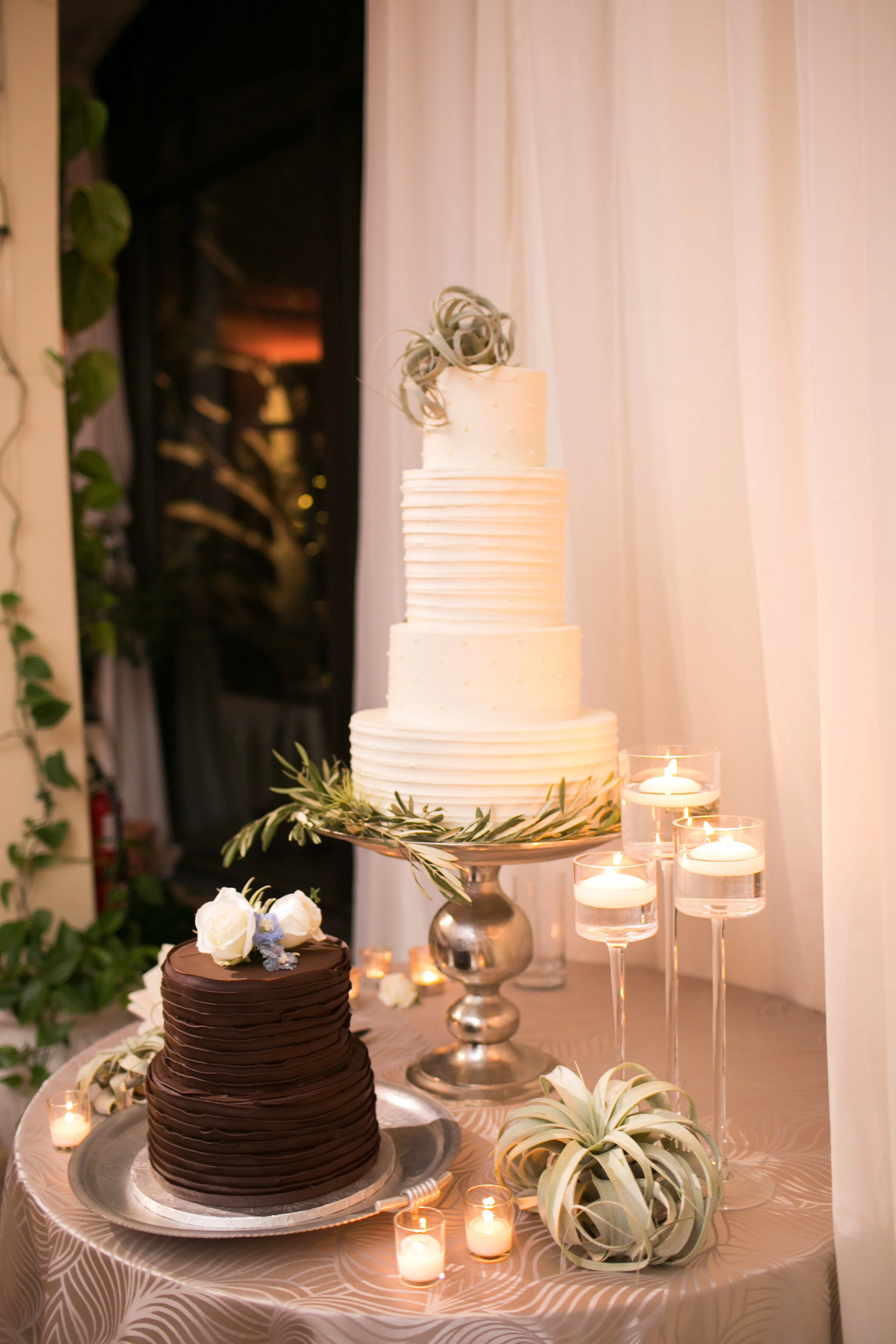 And of course, we finish with dessert! Giant airplants and olive branches decorated the table and cake, with a few floating candles and votives. 
