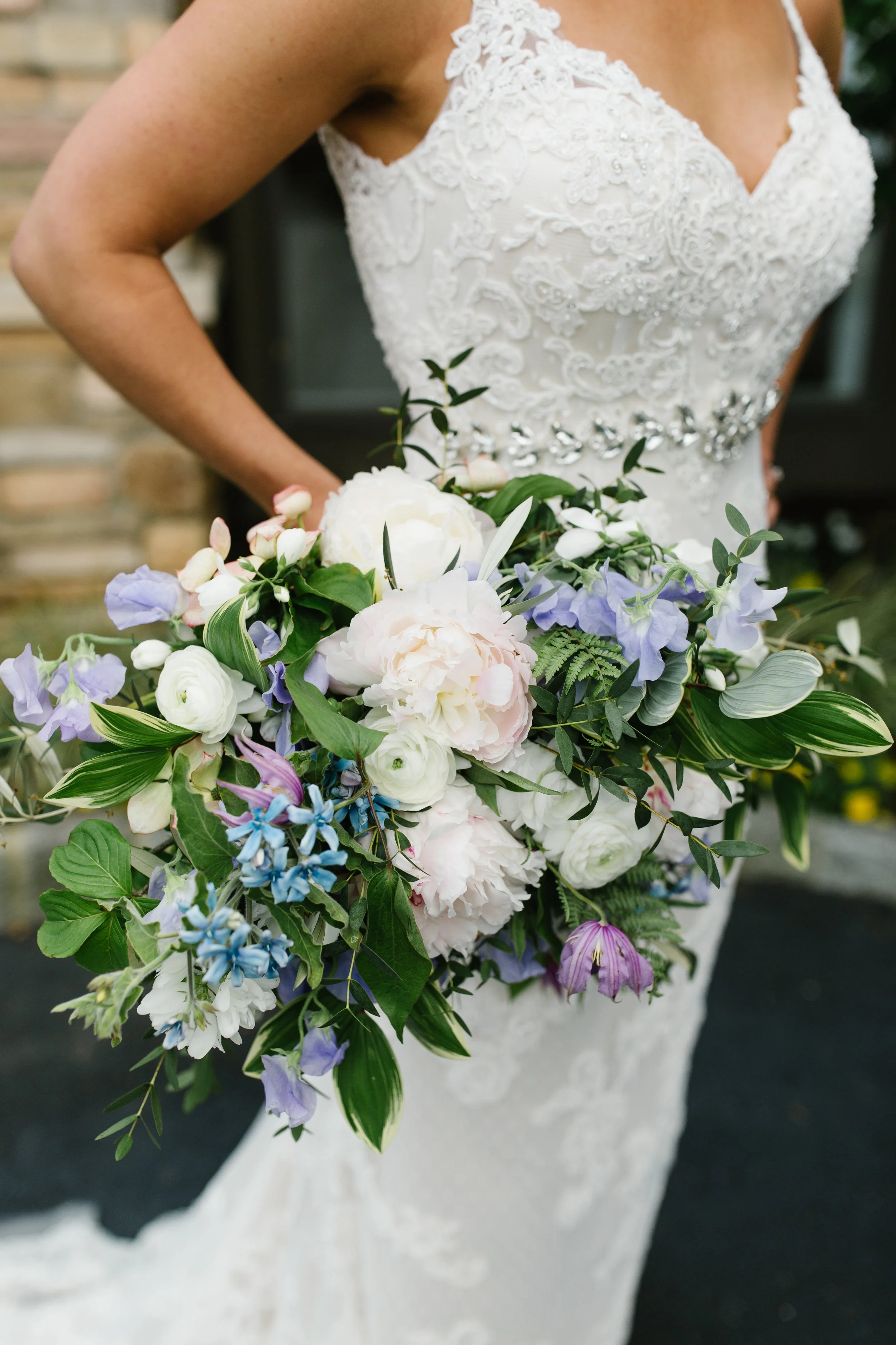 lush horizontal bridal bouquet with spring flowers