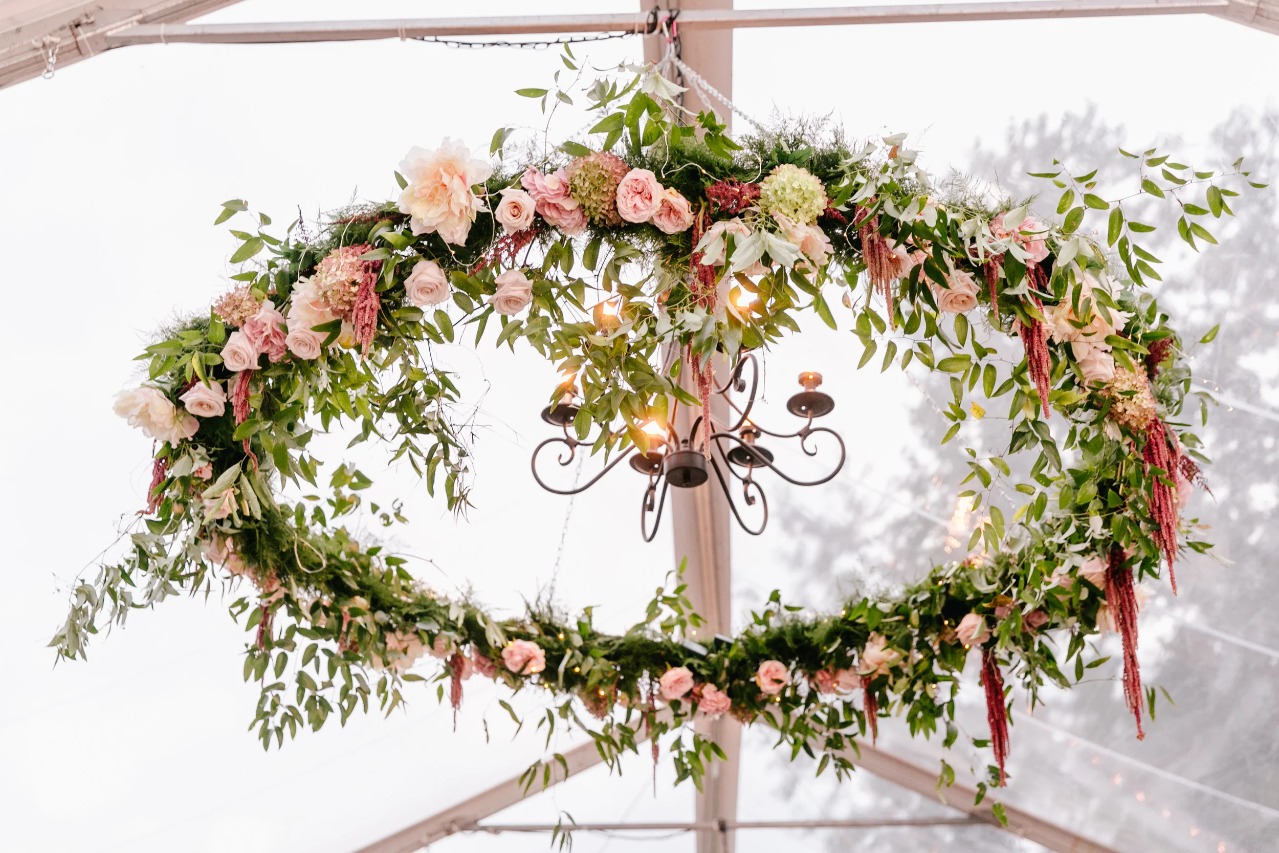 hanging flower installation in tent
