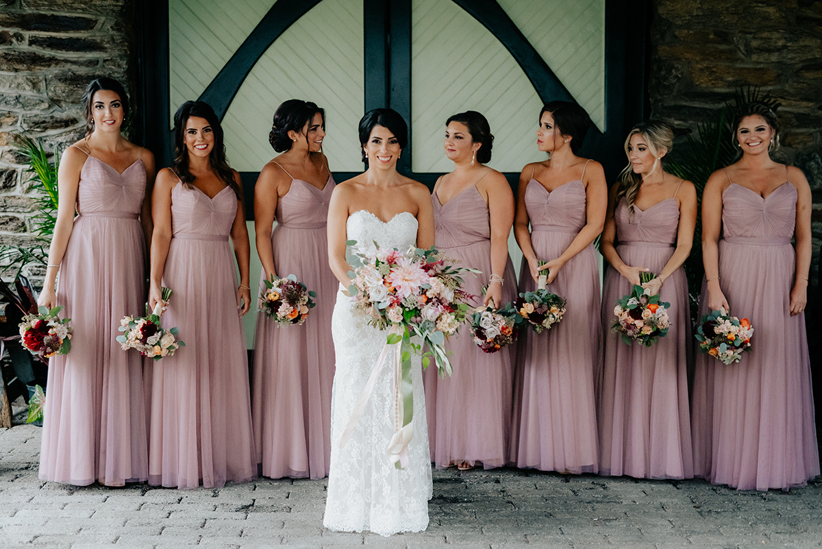 bride and bridesmaids with classic bouquets