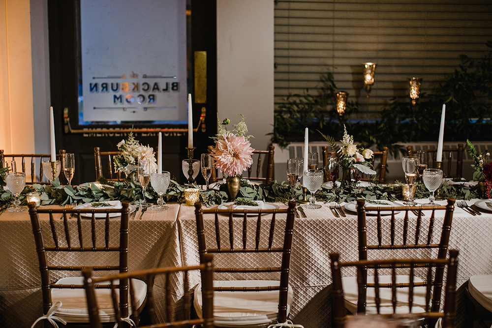 long table with greenery garland