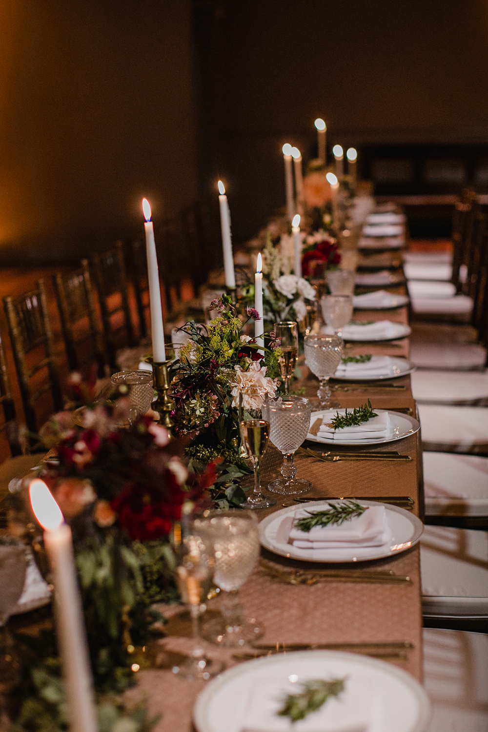 long table with fall flowers and candlesticks