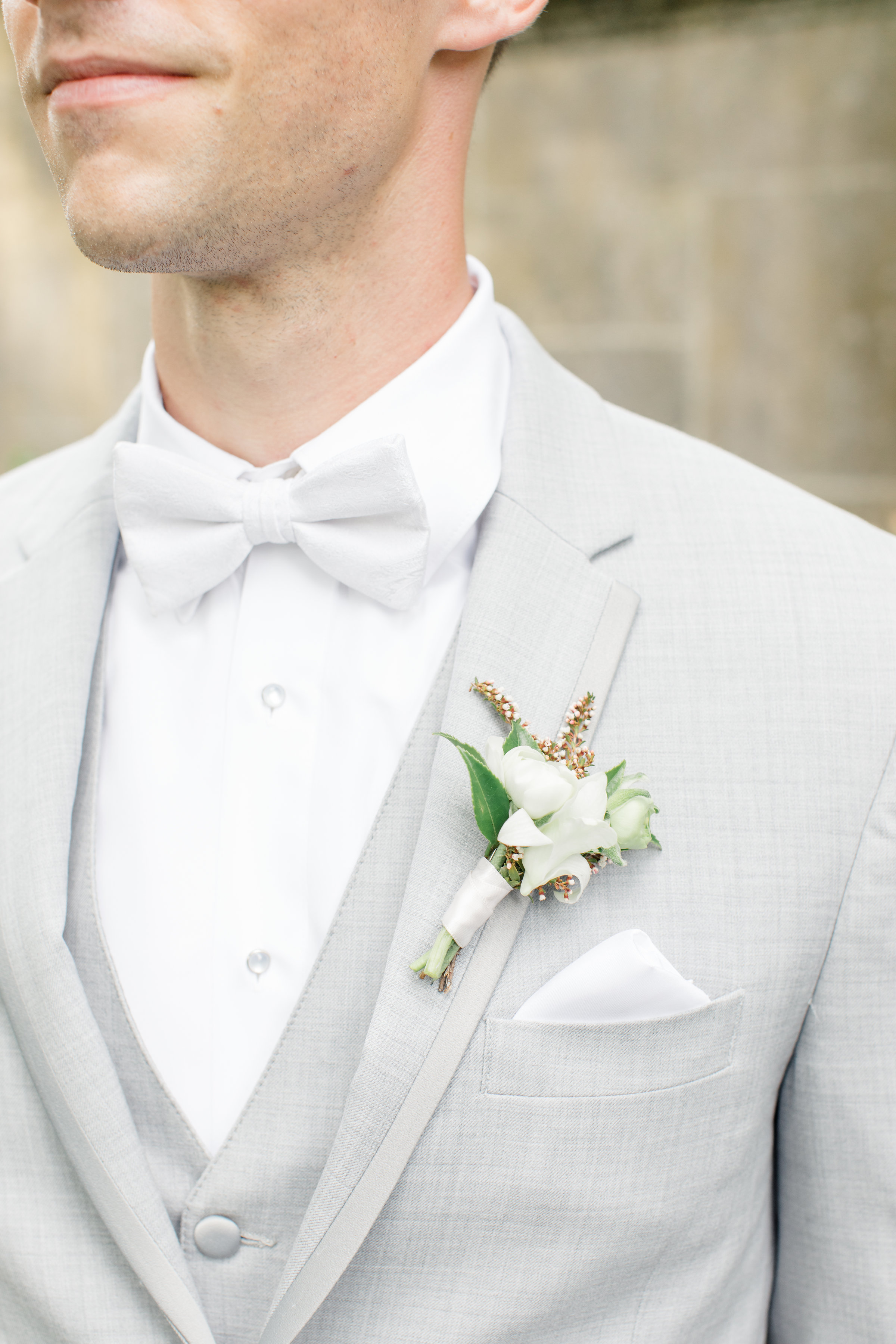 White bout on light grey suit