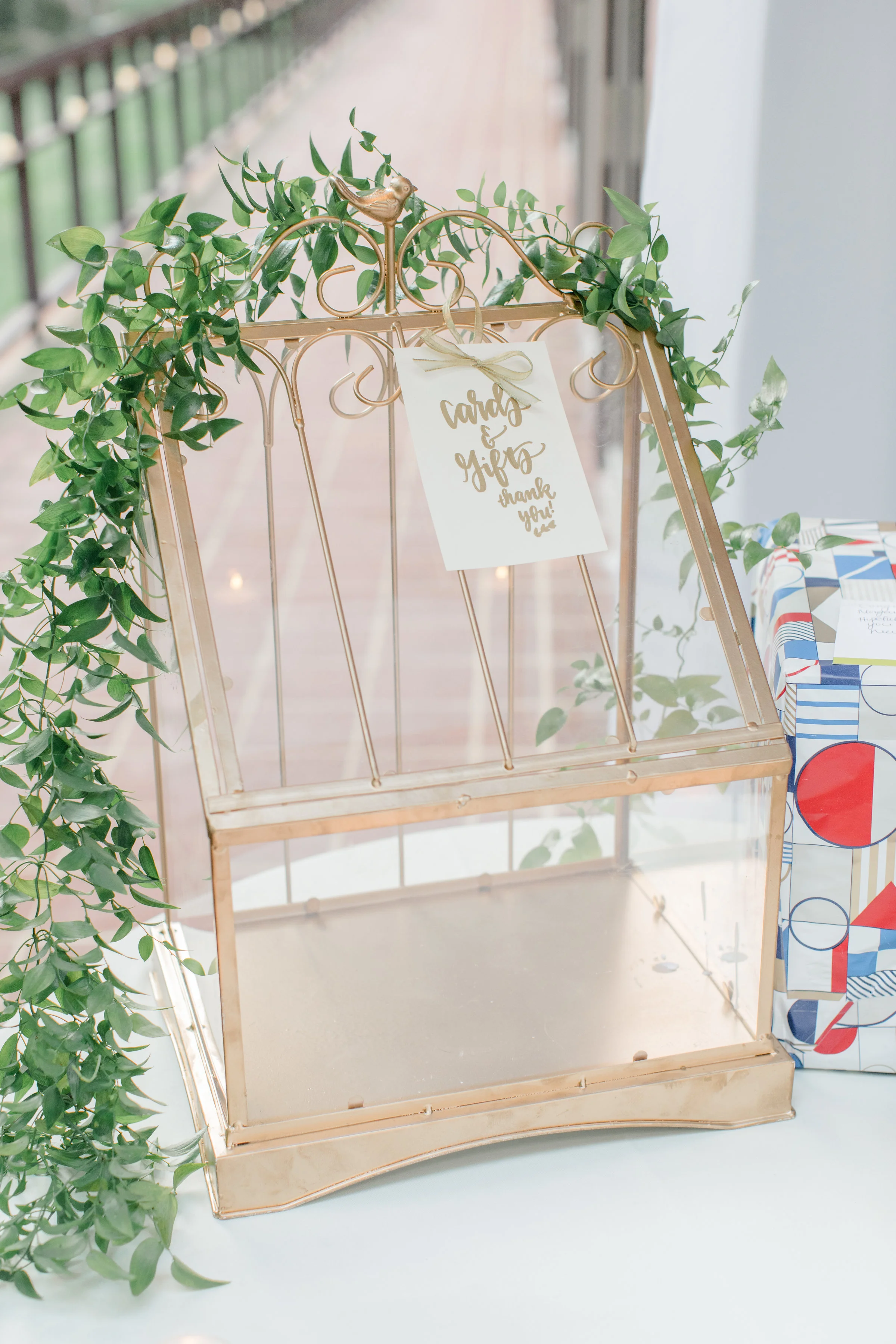 Gold cardholder box with greenery