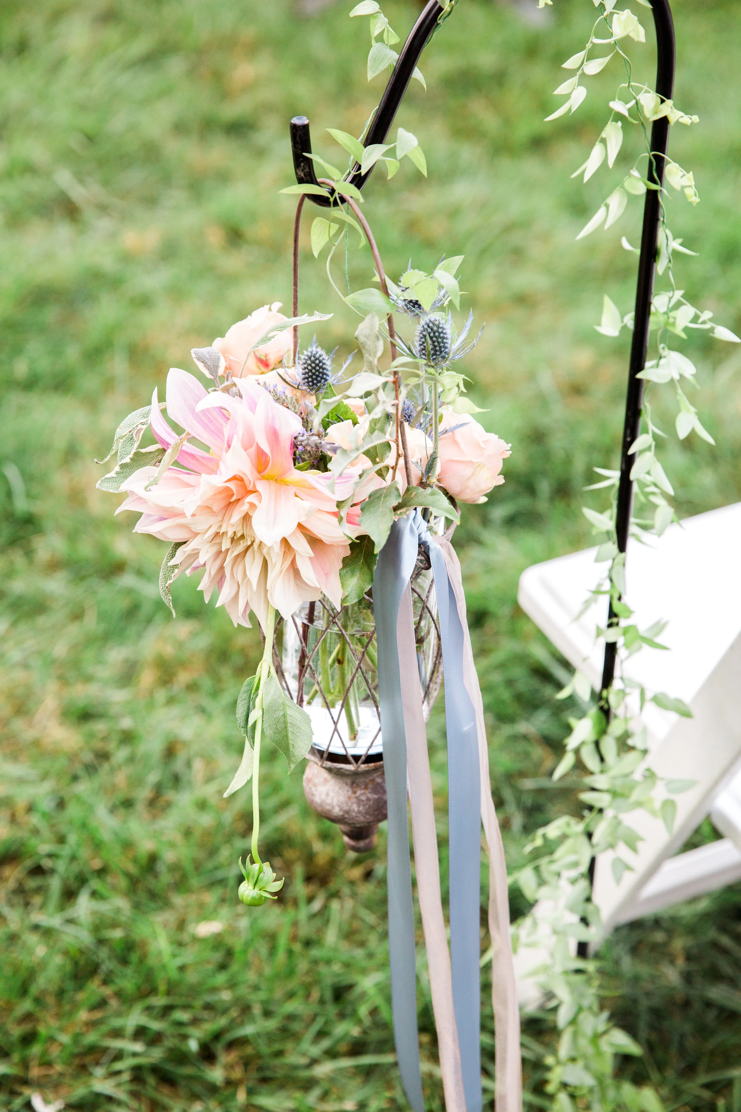 shepherd hooks with lanterns and flowers
