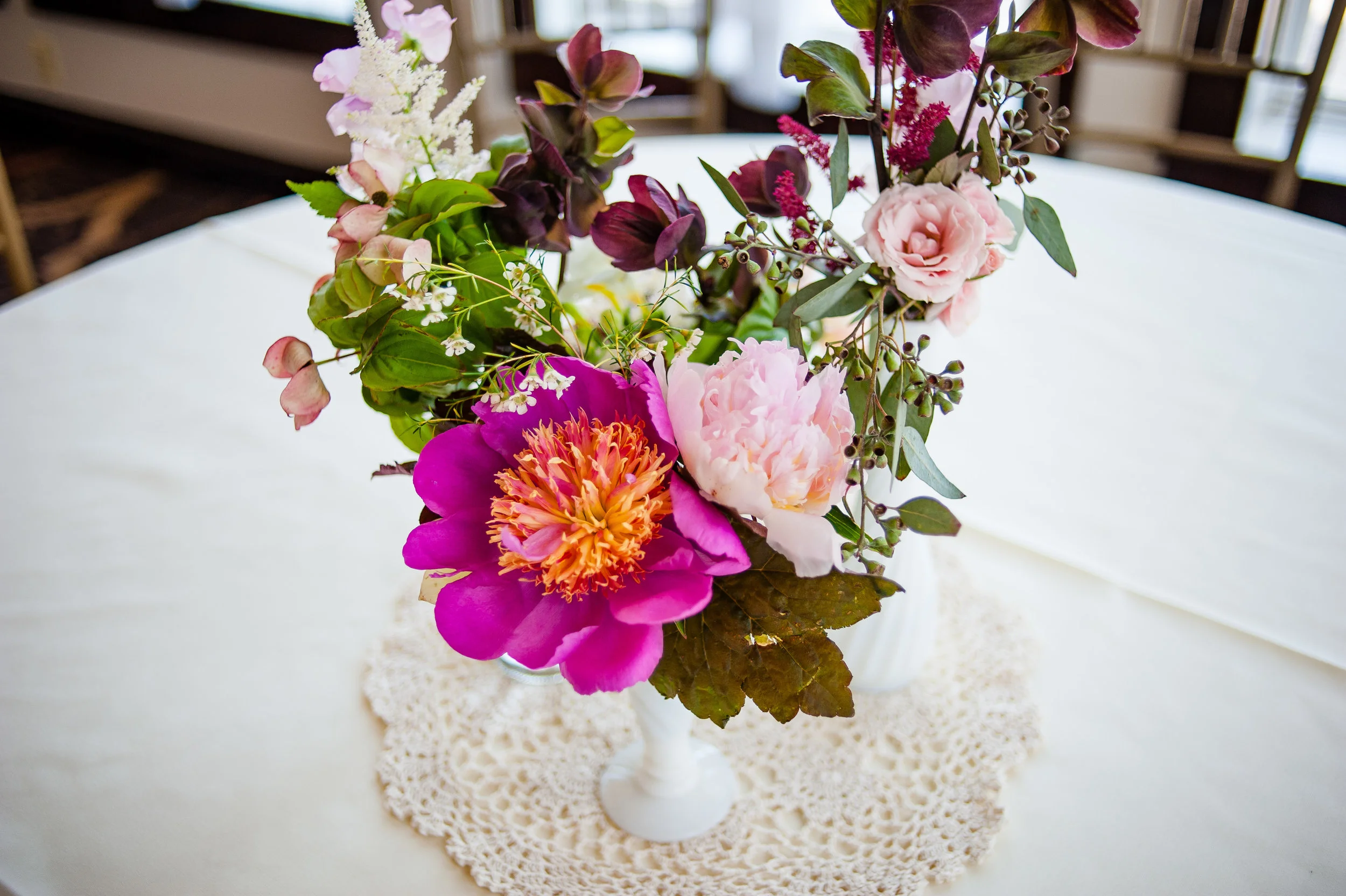 bud vase with bright flowers