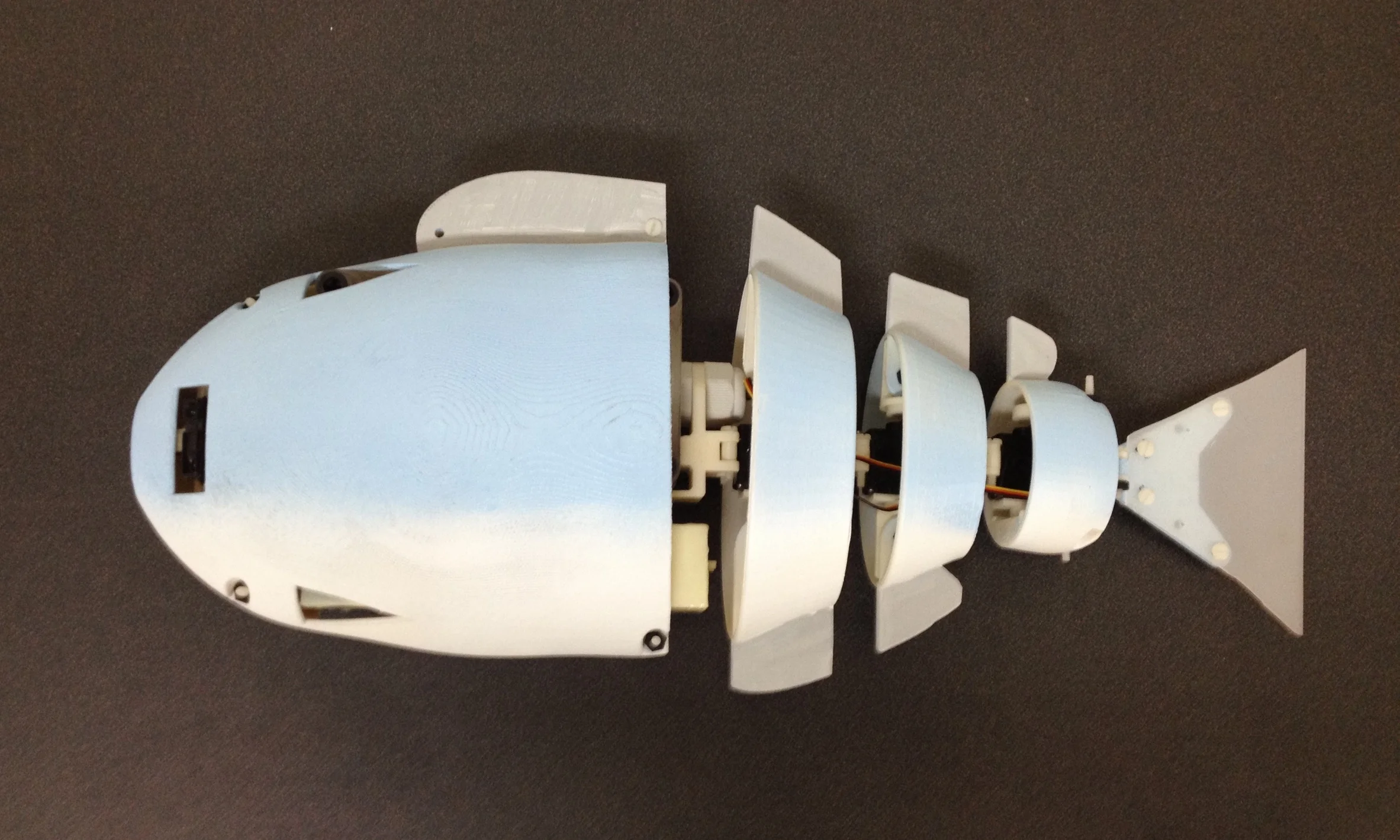 Robotic fish: design and characterization of an interactive iDevice-controlled robotic fish for informal science education