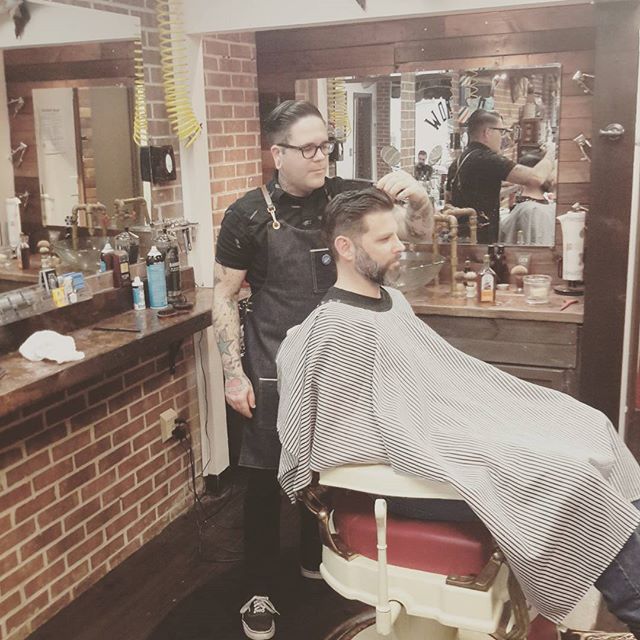 Josh holding it down. Just tamed Mike O from @communitytap wild hair. Support local and buy local. #oldcrowbarbershop #greenvillebarbershop #vintagebarbering #yeahthatgreenville #💈 #barberlife #cleanfade #supportgreenville #communitytap