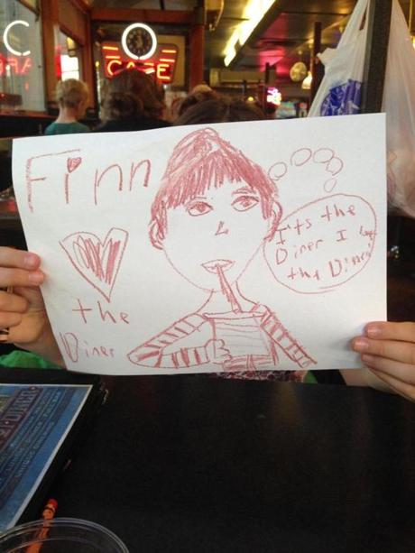 Annabel’s drawing of Finn enjoying the diner.