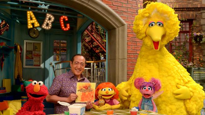 See Amazing in all Children initiative. She'll now appear on TV as well. From left, Elmo, Alan Muraoka, Julia, Abby Cadabby and Big Bird." Julia (center) first appeared online and in printed materials as a part of Sesame Street's See Amazing in all Children initiative. She'll now appear on TV as well. From left, Elmo, Alan Muraoka, Julia, Abby Cadabby and Big Bird. Credit: Zach Hyman