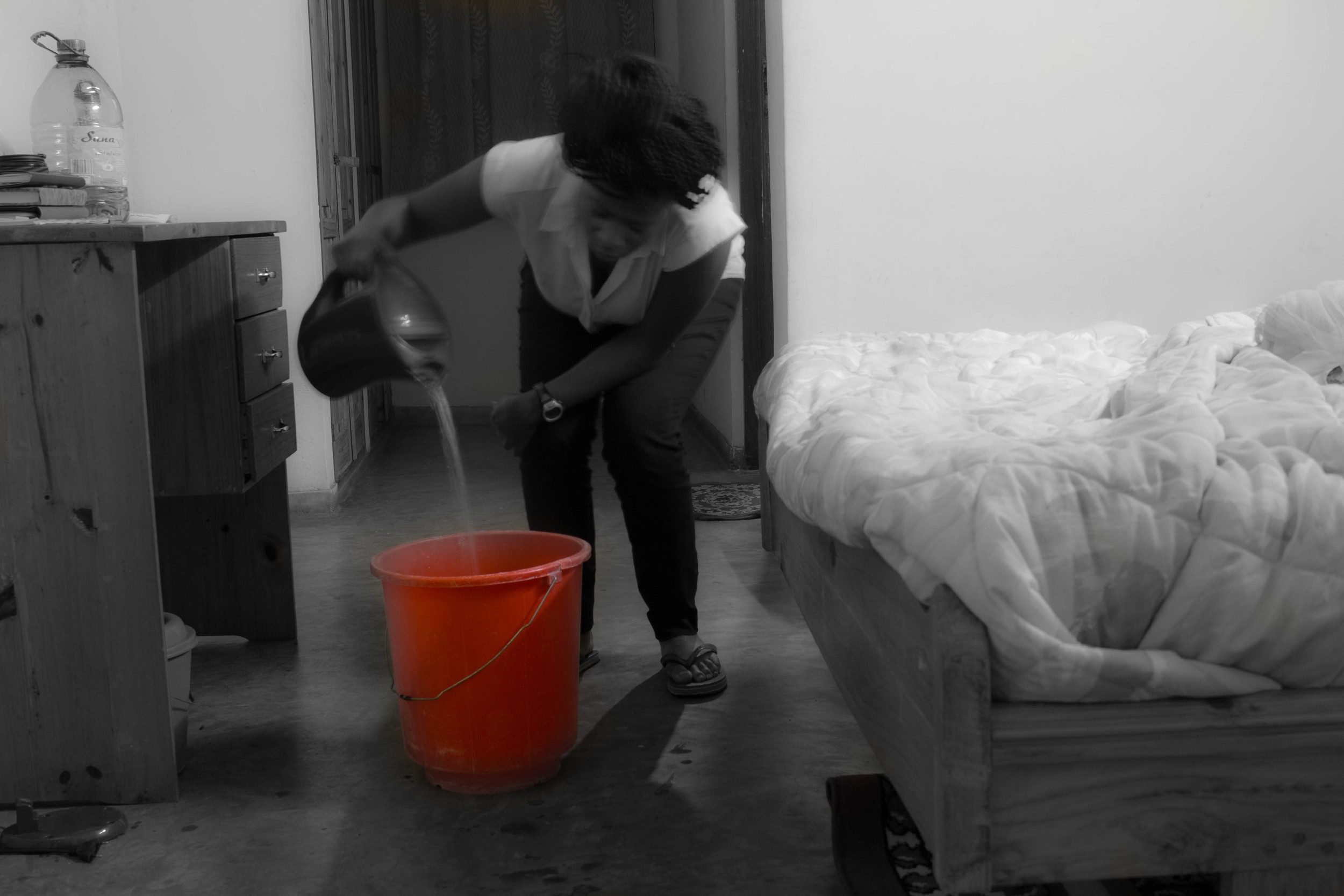 Me preparing for a bucket bath