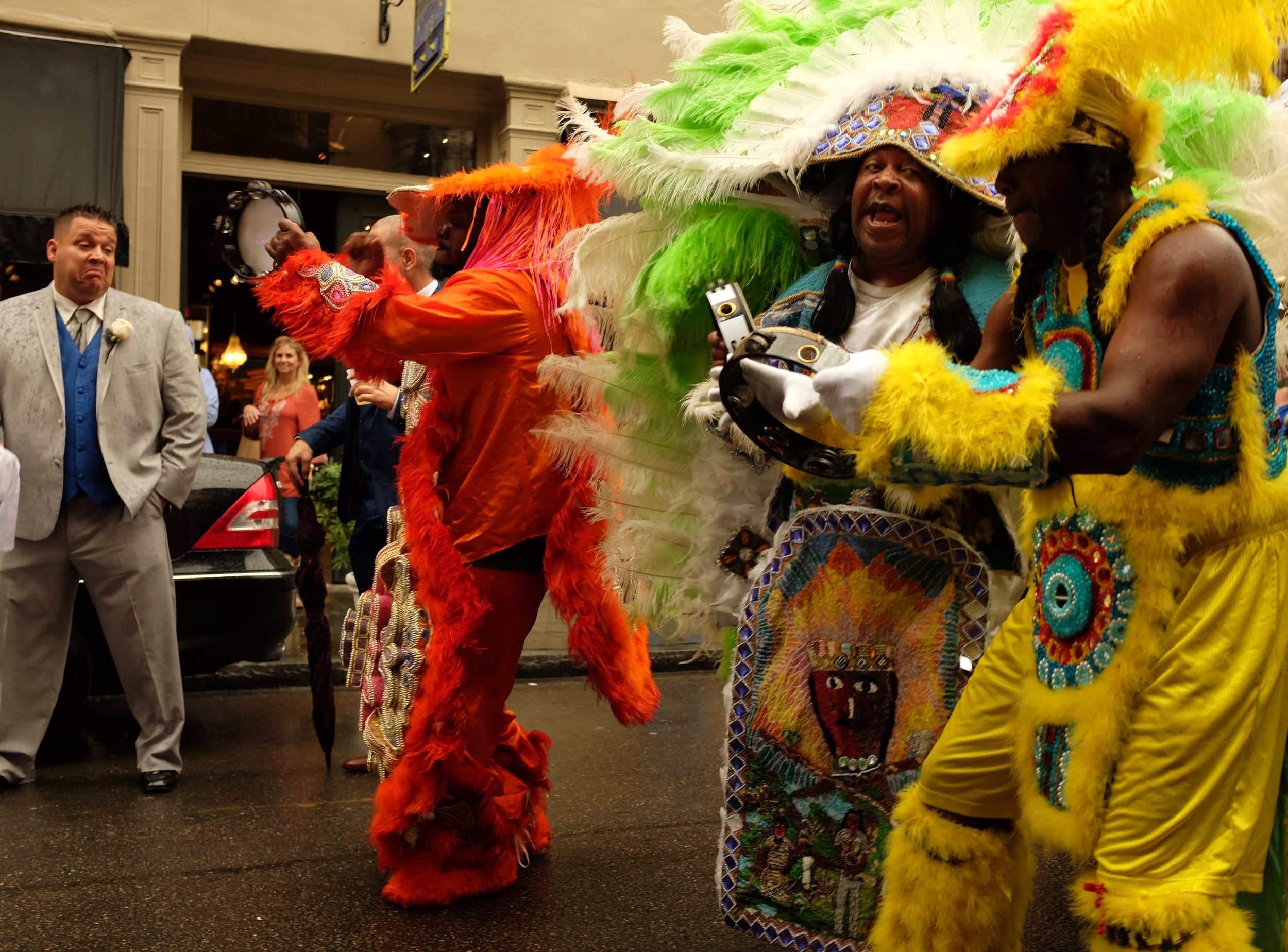 Mardi Gras Indians leading a wedding party, Royal Street, French Quarter. November 21, 2015.