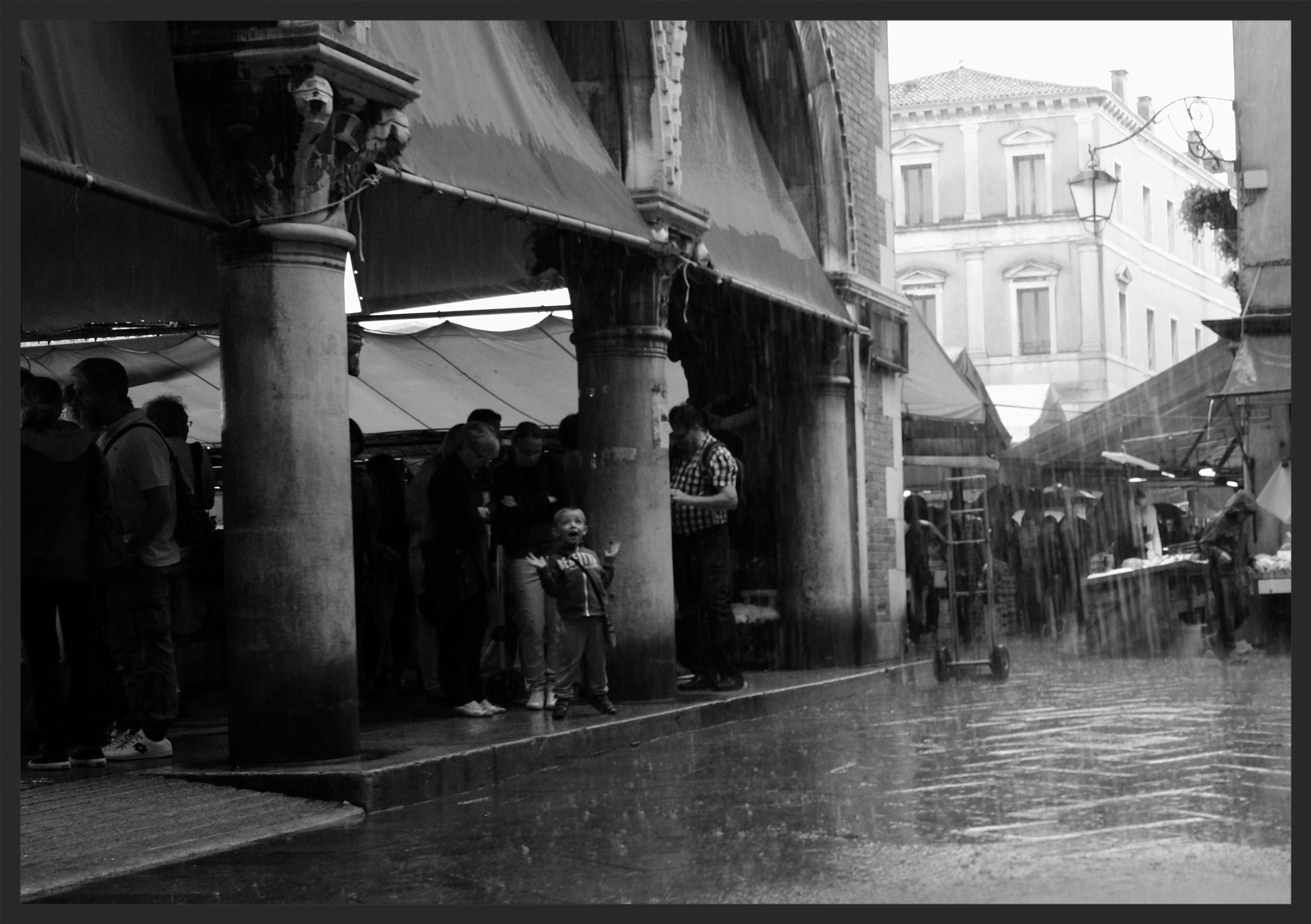 Delight at the rain outside the Rialto Market.