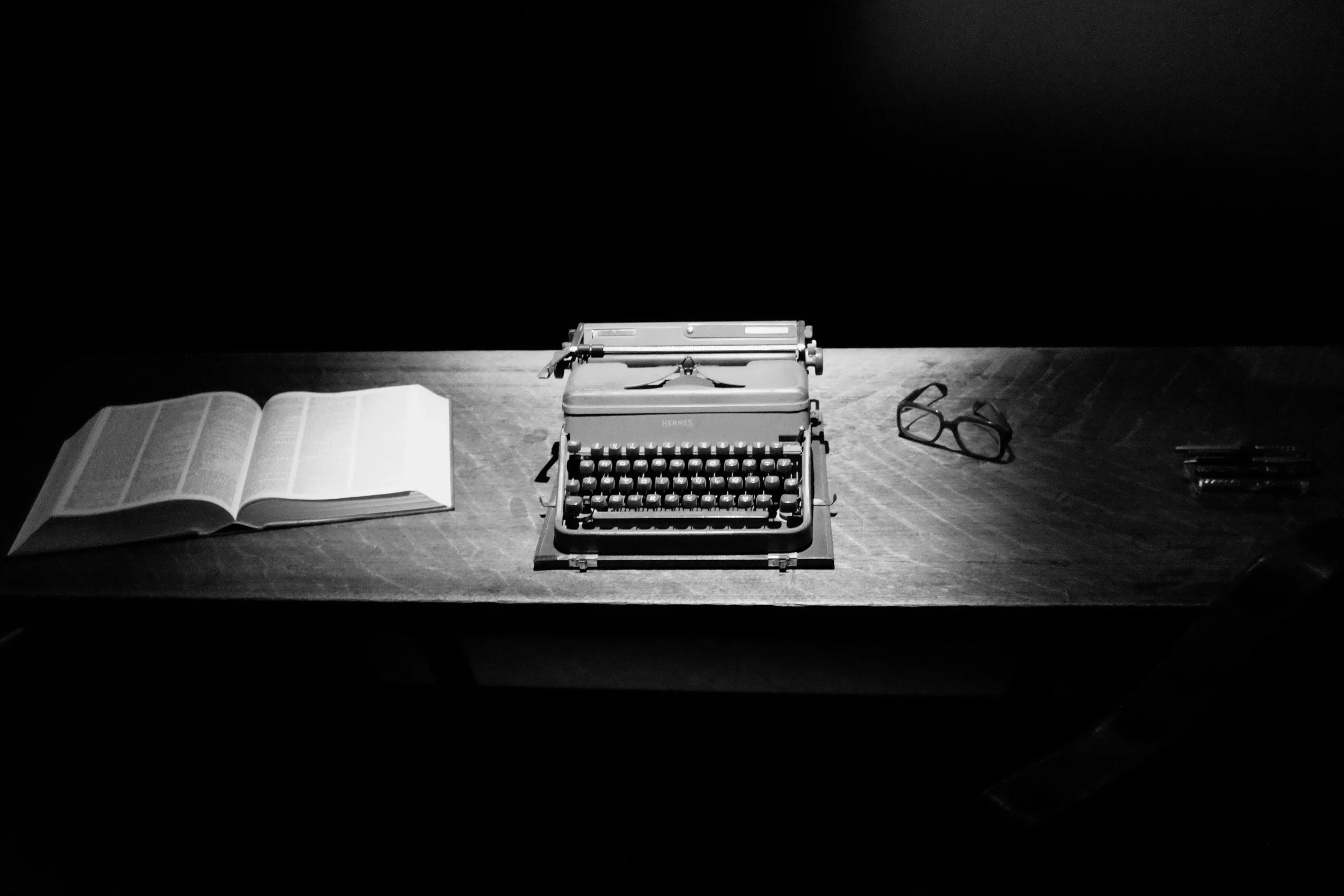 The author's desk, typewriter, dictionary and unmistakable eyeglasses.