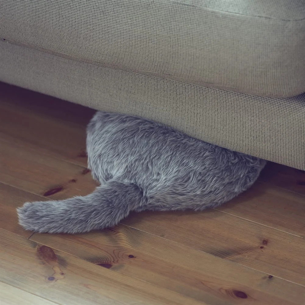 fmag003_qoobo_robotic_cat_tail_cushion_lifestyle_1474_sofa.jpg