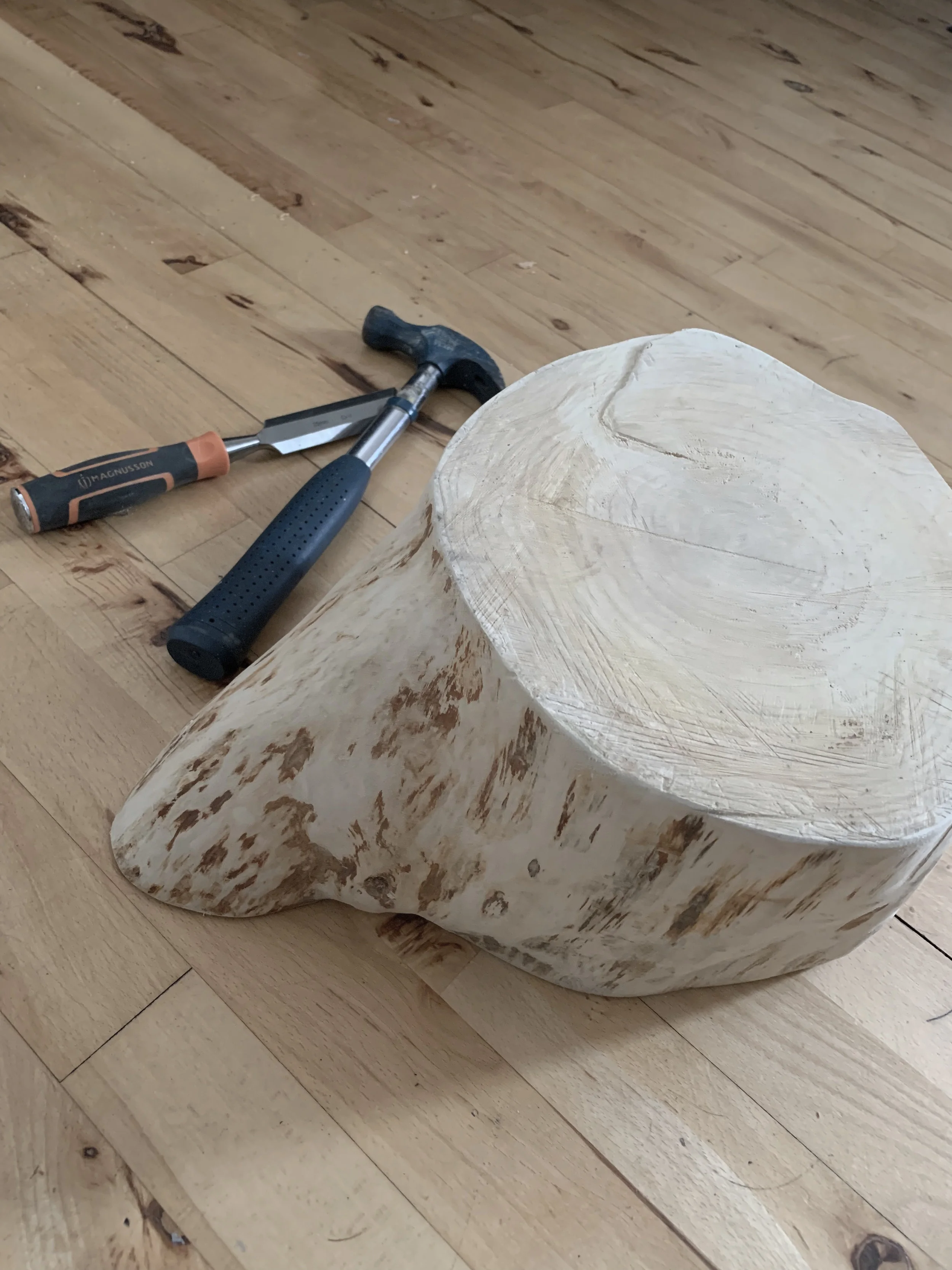 The tree stump section all striped of its bark and sanded smooth