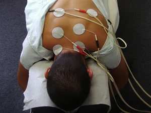 Electric stimulation pads are placed on muscles in spasm.