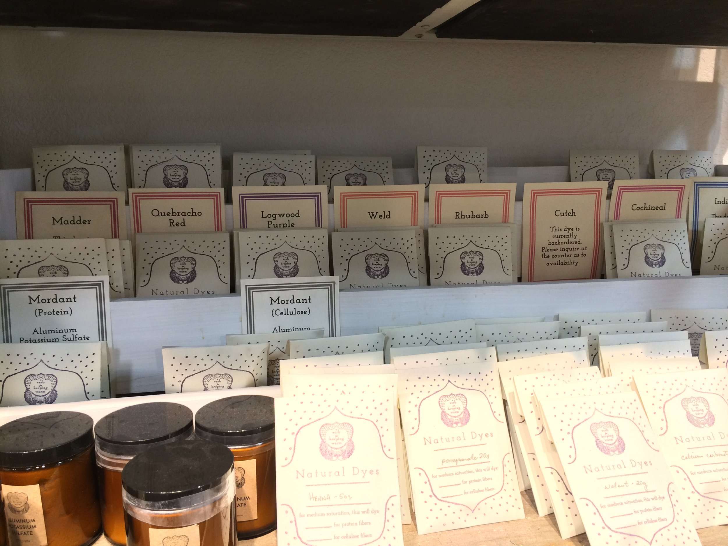 Natural dye extracts and mordants, which create a bond between the fiber and dye, for sale in the retail shop