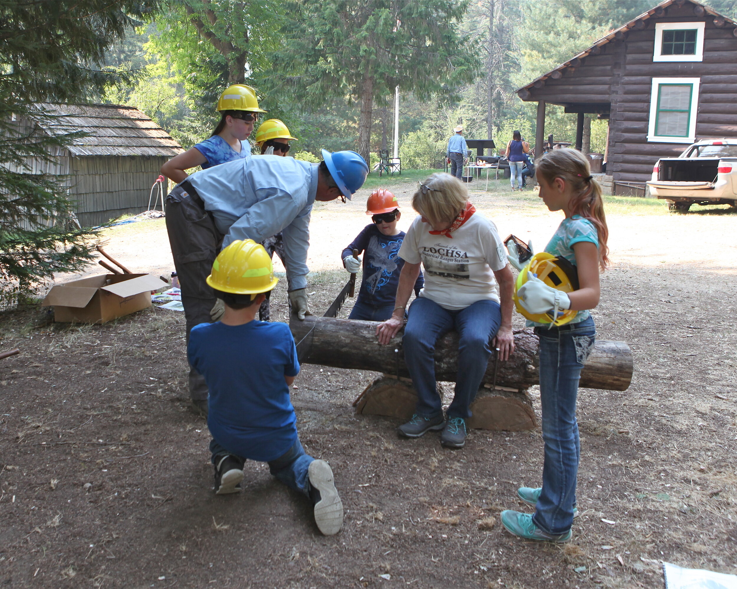 Connie assisting with a x cut saw demonstration at LHRS.JPG