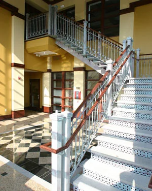 Oconomowoc Lake Plaza: For this project, we were awarded the Bronze Award for Stairs Complete at the 2005 National Ornamental and Miscellaneous Metals Association (NOMMA) Top Job competition. An interesting combination of Mediterranean style railings, decorative laser cut risers, stone treads, and steel tube stringers embellish the entry to the retail plaza.