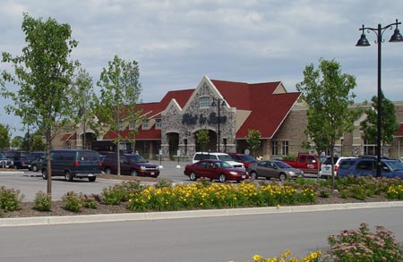 Pick N Save at Pabst Farms: The Pabst Farms project was of particular interest due to the high end quality and high exposure of all of the buildings within the complex. We fabricated the steel for approximately 12 Pick N Save stores in Southeast Wisconsin. The Pabst Farms project was of particular interest due to the high end quality and high exposure of all of the buildings within the complex. We participated in the design/build process early on assisting in value engineering to help keep the project within the budget. The structural steel, the steel joist and girders were very involved to detail and to fabricate. Many one of kind components were required to achieve the beautiful appearance of the structures. Incorporated in the architectural details of the buildings we fabricated many decorative iron elements including the canopy brackets and laser cut Pabst Farms logos cut thru door handles and shopping cart corrals. Our vast experience with Pick n Save stores allow us to be familiar and efficient with the shop drawings and production of the steel components. We take great pride in the high level of communication and service we provide to keep our projects on schedule.