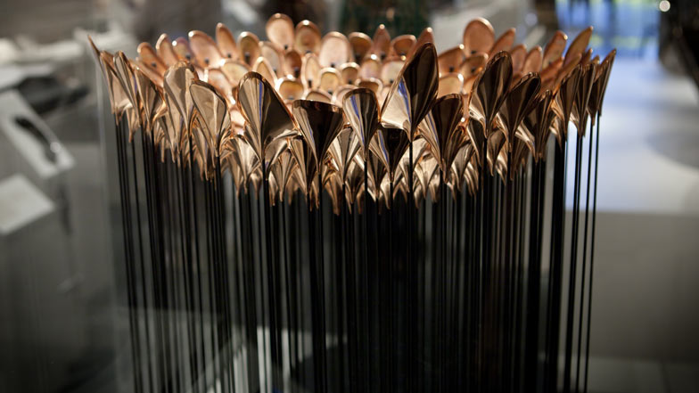Olympic Cauldron Scale Model: The Studio set out to design a moment that would be memorable throughout the Olympics. They ultimately asked themselves: How do you let every country in the Olympic games take part in making and lighting the Olympic Cauldron? Each of the 204 copper pieces was hammered by hand out of flat sheets using a craft technique that was used for restoring historic cars. Each Olympic team lit one piece during the opening ceremony. After the Olympic games were over all of the 204 pieces were sent to the participating countries.