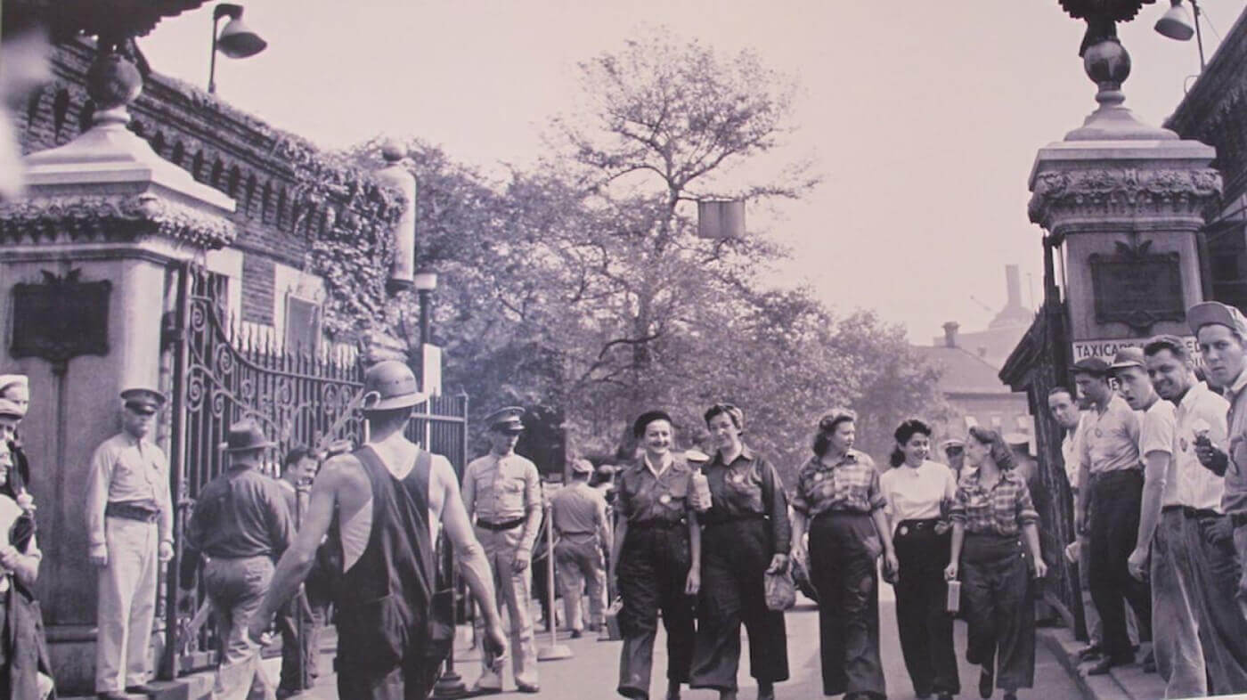 Women iron workers leaving the BNY through the Sands Street entrance. Note the carton of milk in her hand. Physicians used to recommend drinking milk to help with the soldering fumes.