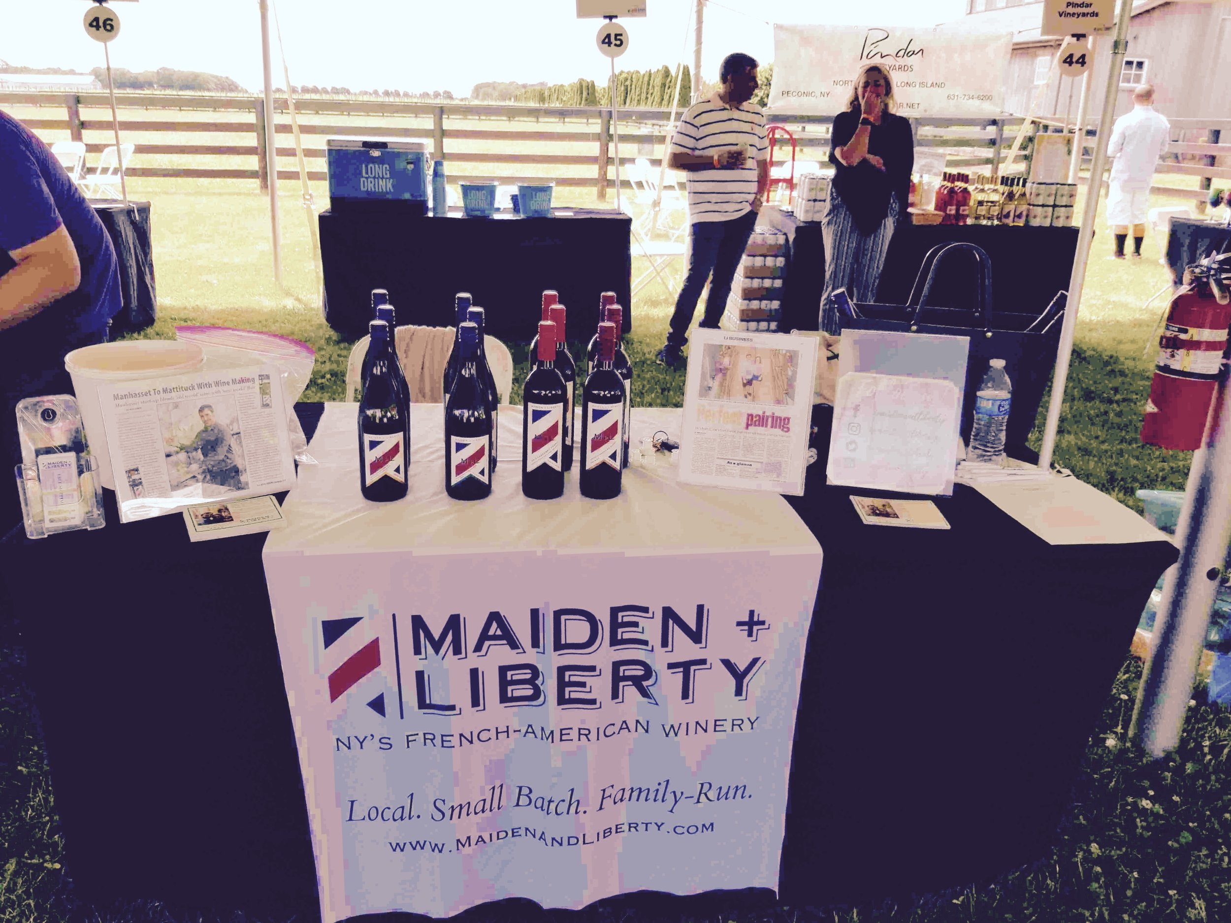 A close up of our tasting booth at North Fork Crush 2019 at RGNY Vineyard (formerly Martha Clara) In Long Island New York.