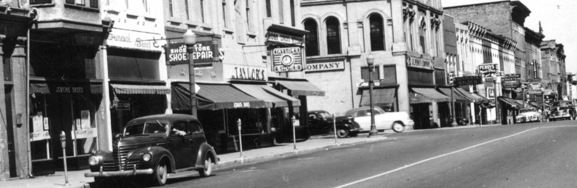 Here are several shoe stores along the street , J.C. Penny's and Perrys Clothing store.
