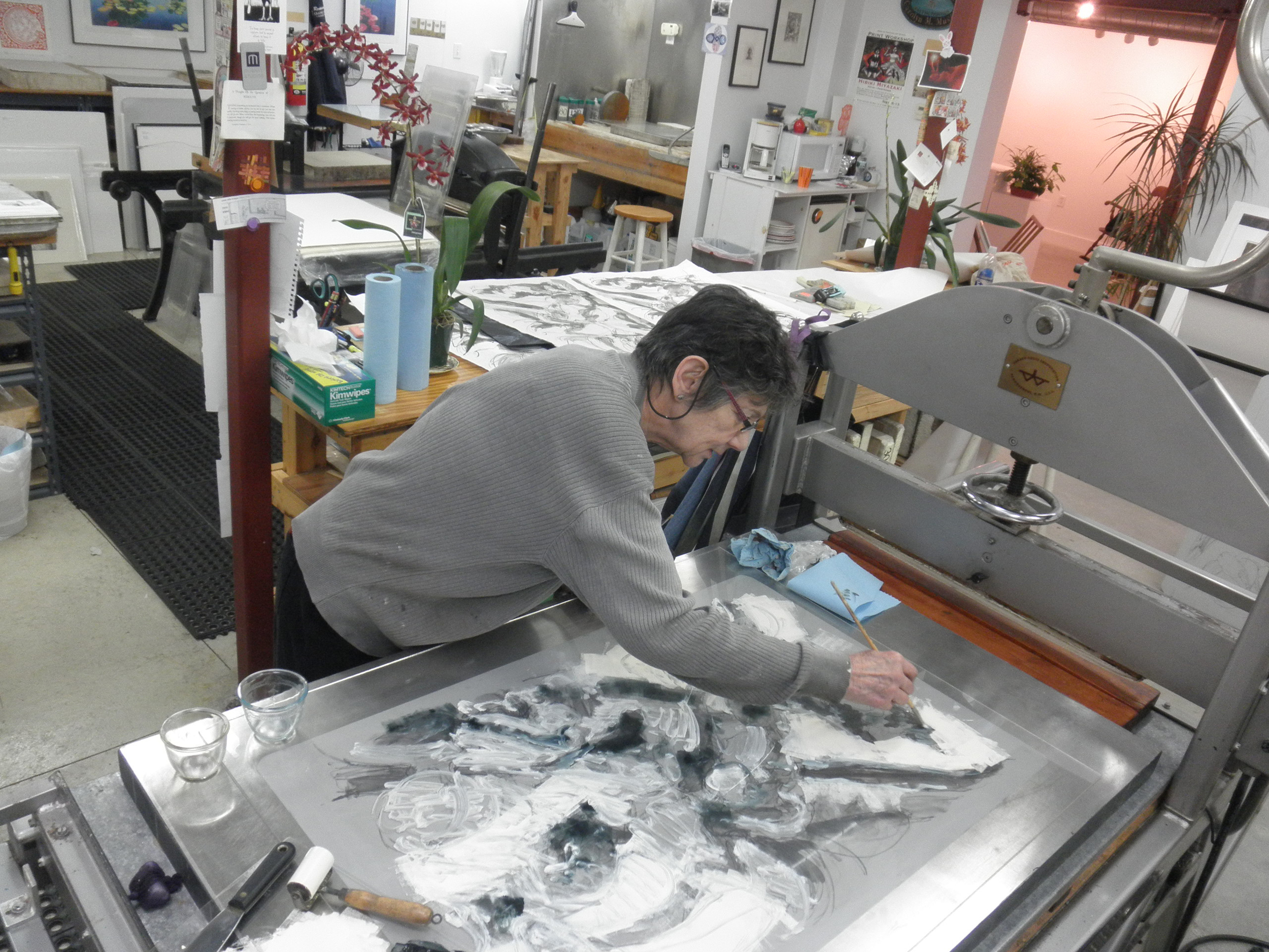 Artist Cynthia Maurice working at press.