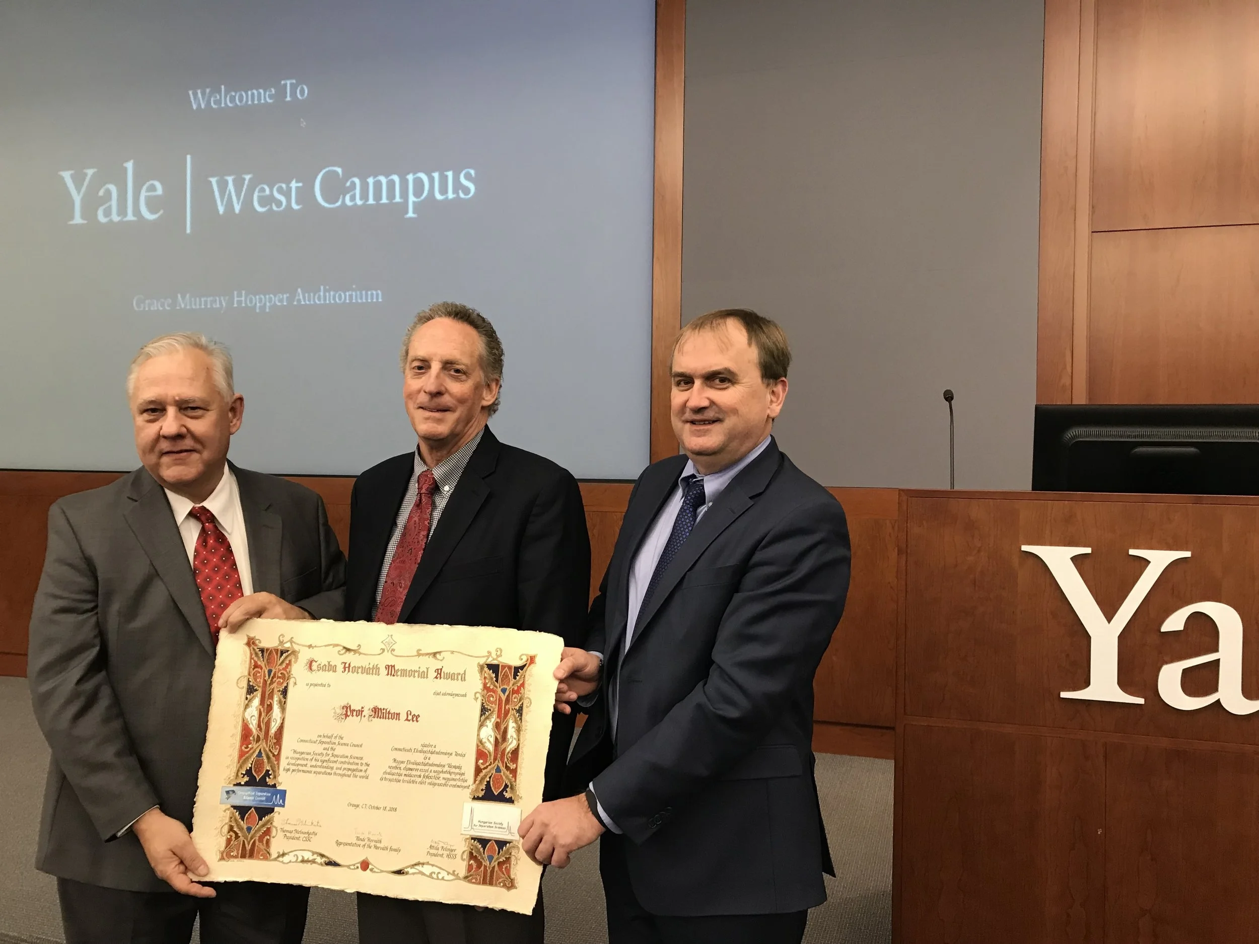 Prof. Lee receiving the scroll